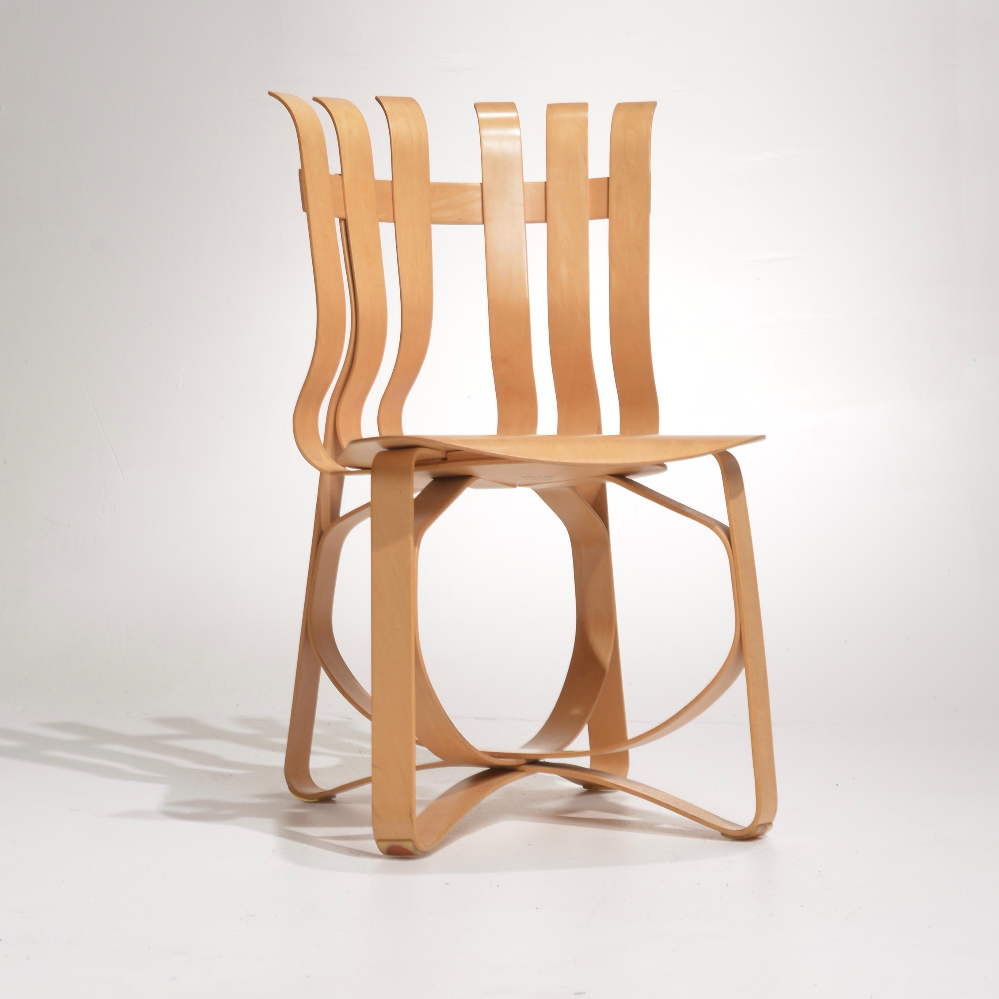 Inspired by the apple crates he played with as a child, Frank Gehry created a collection of bentwood furniture. Using ribbon-like design he transcended the conventions of style in the modernistic way of challenging form from function. Constructed of