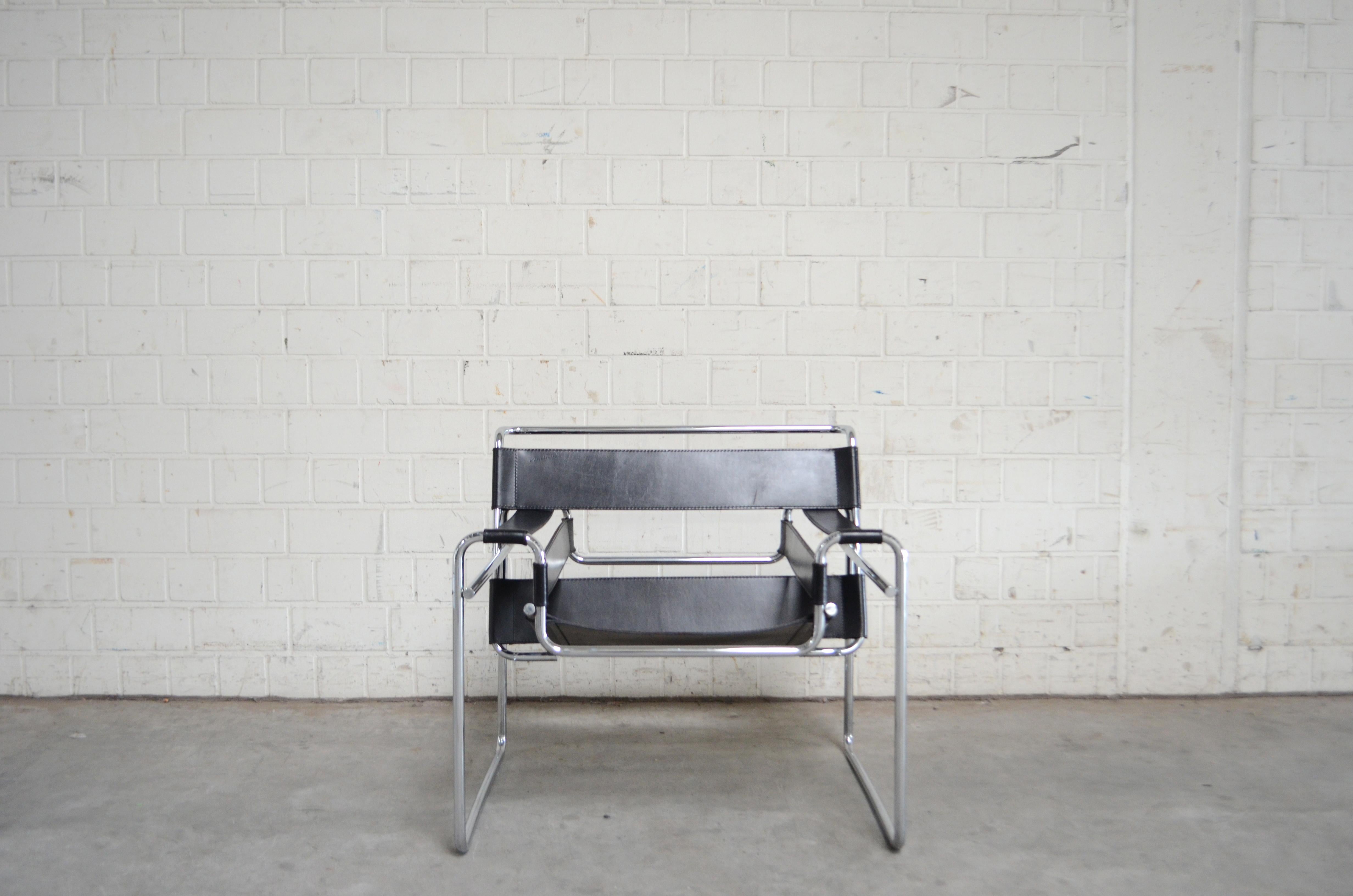 This Wassily chair, in chromed tubular steel and black leather, was designed by Marcel Breuer and produced by Knoll International.
This is one of the most Bauhaus Chair and a timeless masterpiece.

 