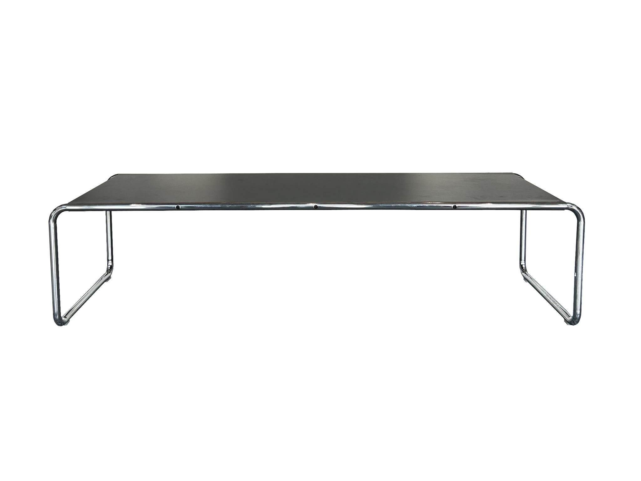 The Laccio coffee table was originally designed in 1925 by Marcel Breuer and is now produced by Knoll. Breuer's use of tubular steel was groundbreaking and enabled him to create pieces that were lightweight yet sturdy. Here the tubular steel frame