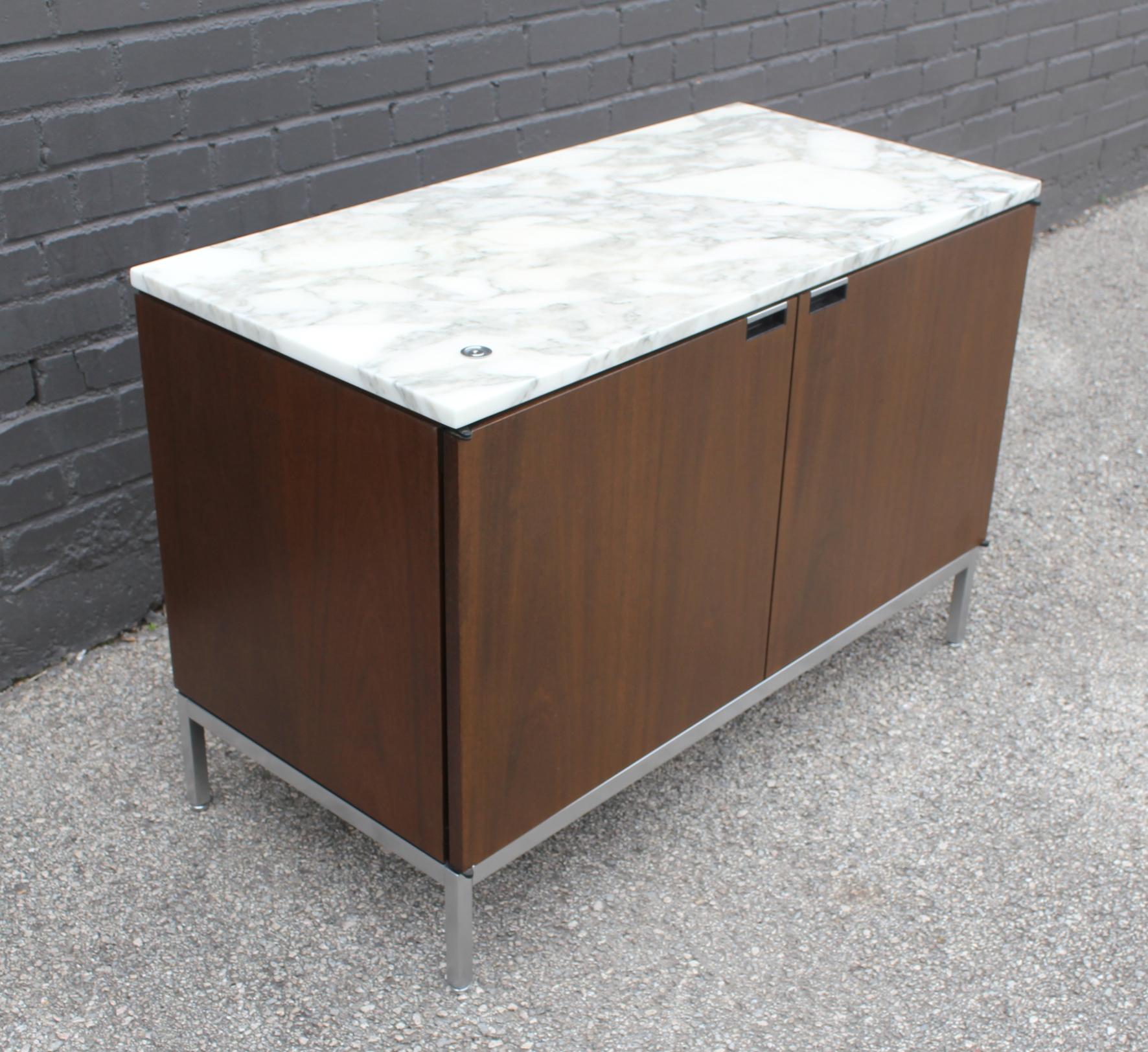 Authentic Florence knoll credenza with marble top. Includes original Knoll branded key to lock the doors. All 4 adjustable levelers are intact. Very good original condition.