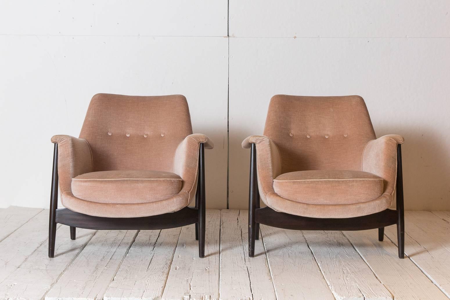 Knoll midcentury club chairs upholstered in velvet with exposed mahogany base.