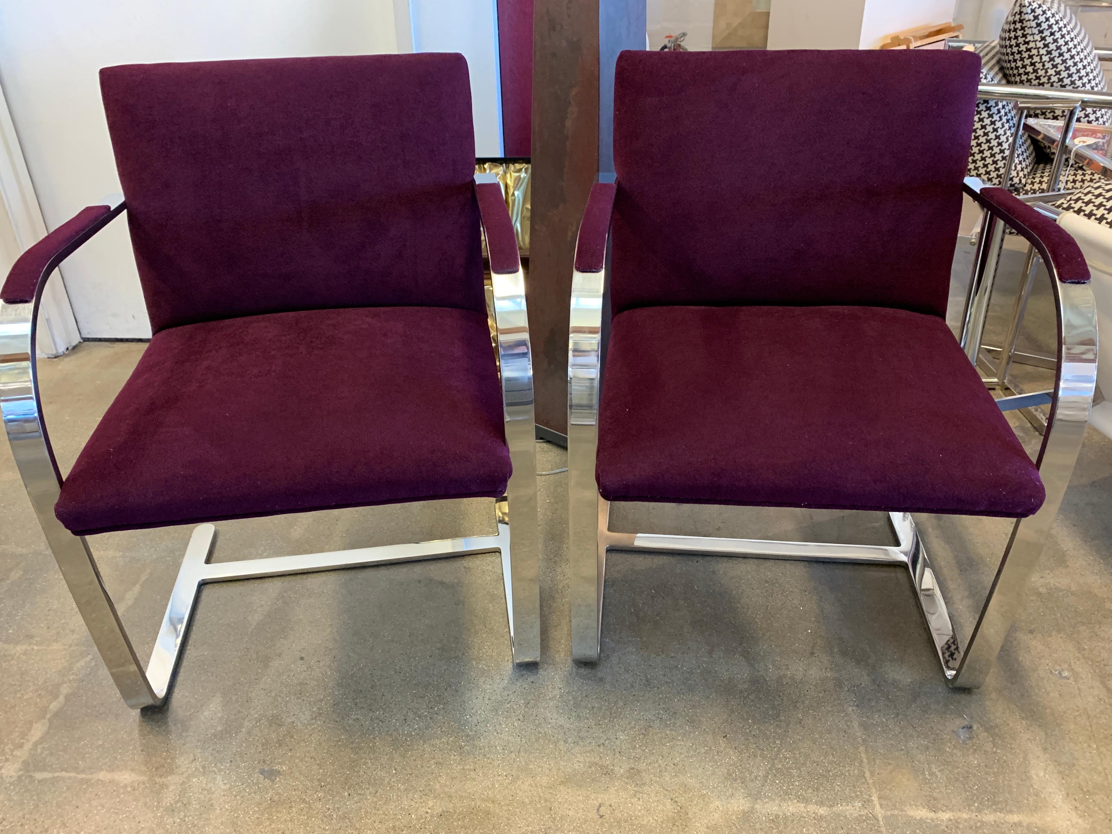 A nice pair of Labeled Knoll Mies van der Rohe flat bar chairs. Only one chair still bears the label which dates to 1980. The original fabric was brick red but we had the chairs re-upholstered. We had the upholsterer re-use the original labels. They