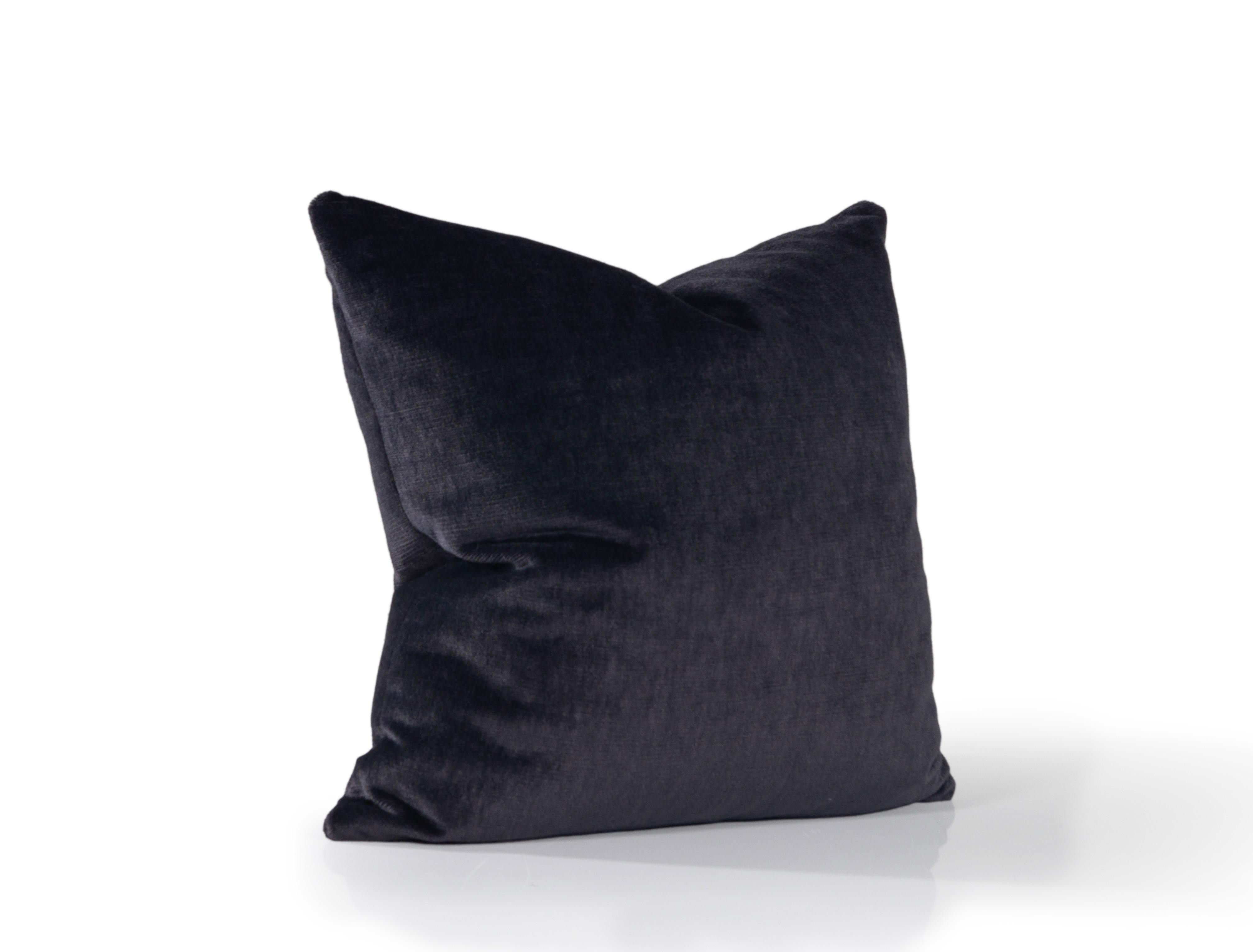 Add a touch of luxury to your home with our down-filled throw pillows. Fashioned in black velvet and delicately trimmed with oyster velvet detailing, they're the perfect statement for any room. These pillows feature a knife edge and hidden zipper.