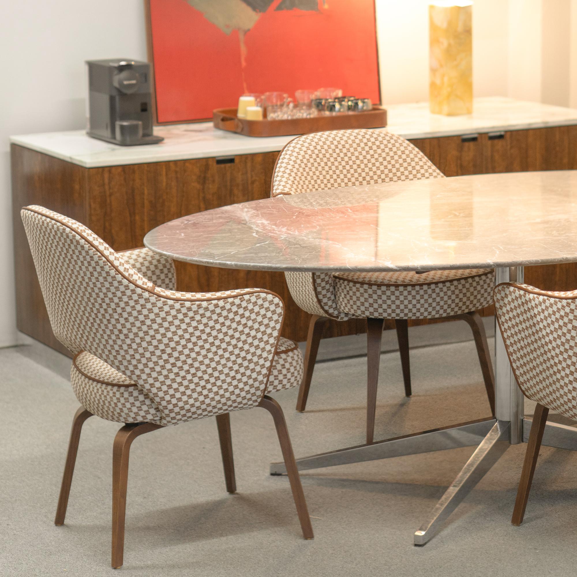 Eero Saarinen is widely regarded as one of the most influential furniture designers of the 20th century, celebrated for his innovative use of materials and sculptural approach to form. His iconic designs for Knoll, such as the Tulip Chair, Womb
