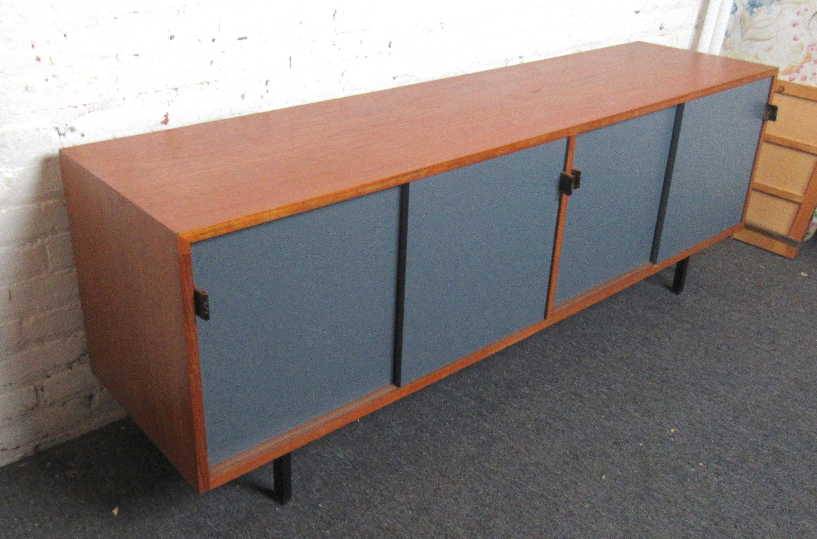 Mid-Century Modern long credenza with blue doors and black leather pulls. Ample storage for living or dining room.
(Please confirm item location - NY or NJ - with dealer).
 