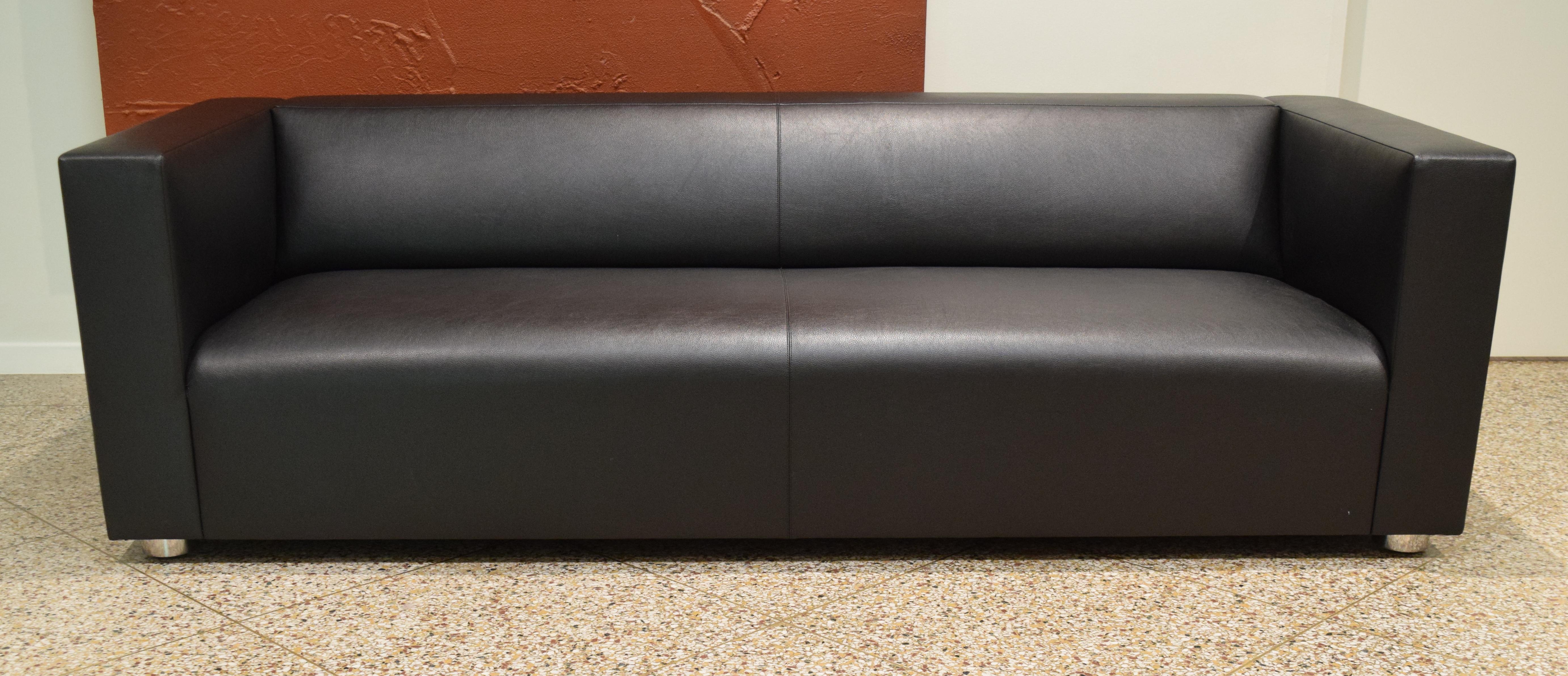 Store closing. Offers welcome! Stylish and streamlined sofa by Peter Shelton and Lee Mindel for Knoll. Upholstered in a black Knoll Textile (Prairie Bison) paired with polished stainless steel legs. Signed with manufacturer's tag and KnollStudio