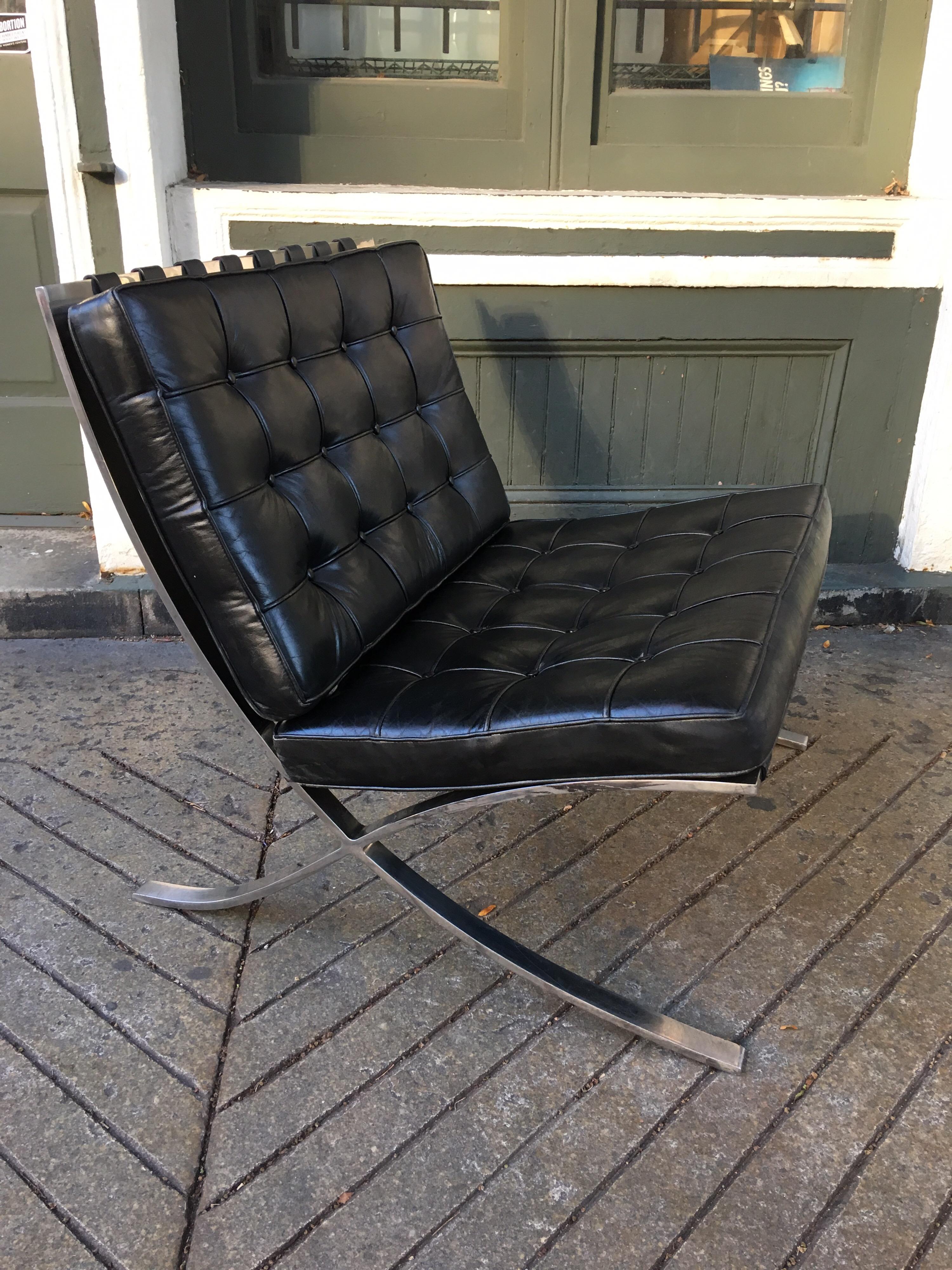 Ludwig Mies van der Rohe Barcelona chair in black leather and stainless steel. Produced by Knoll, this chair dates to the late 1970s. Leather shows small amount of wear, but overall presents very well. Classic comfortable chair!