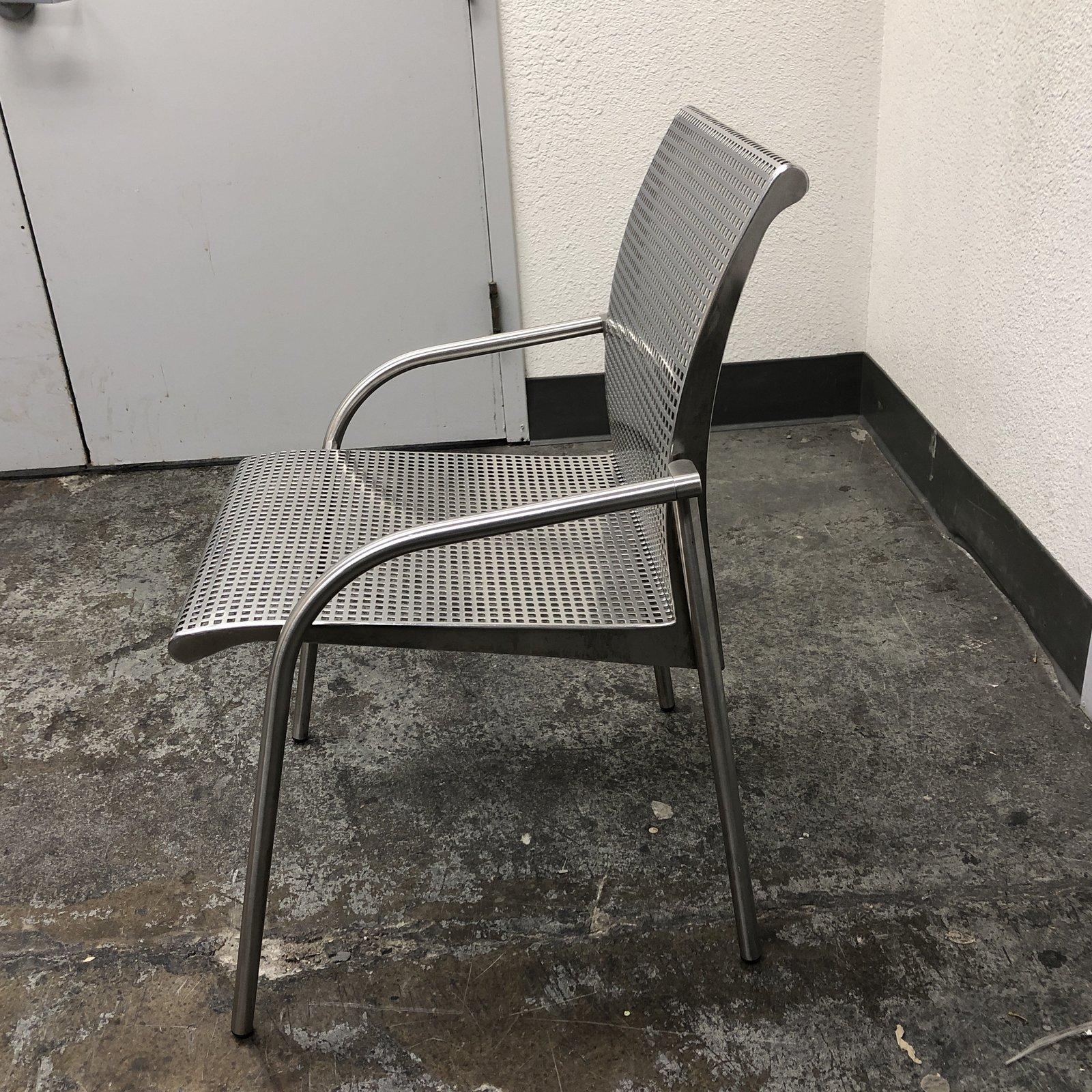 A Knoll style stainless steel armchair. Elegant design, made to last and built to withstand many environments. The stainless steel can add a great accent to a room. Measures: Arm height 22 inches, seat height 18 inches.

  