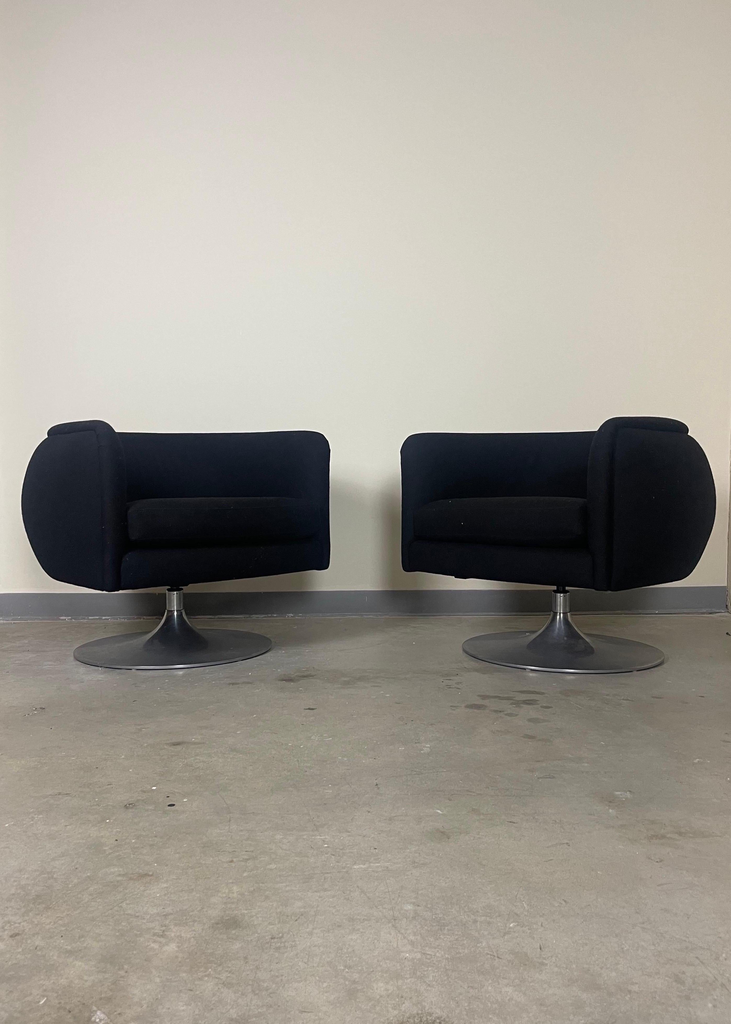Set of two chairs manufactured by Knoll and designed by Joe D’Urso. Upholstered in black wool. Minor wear to the steel swivel bases. Upholstery is in great condition. Original tags intact.