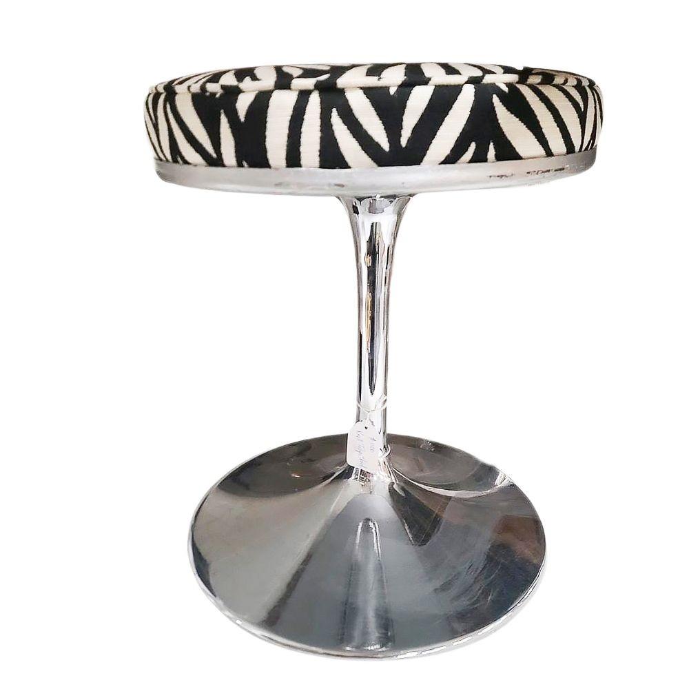 Eero Saarinen designed a chrome stool with a 