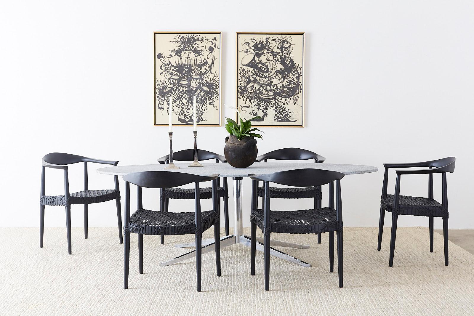 Rare and unusual natural granite stone oval dining table or conference table by Knoll. Features a large slab of unhoned gray granite mounted to a chrome star base with the Knoll signature. The exquisite piece of stone has a hand-chiseled edge and a