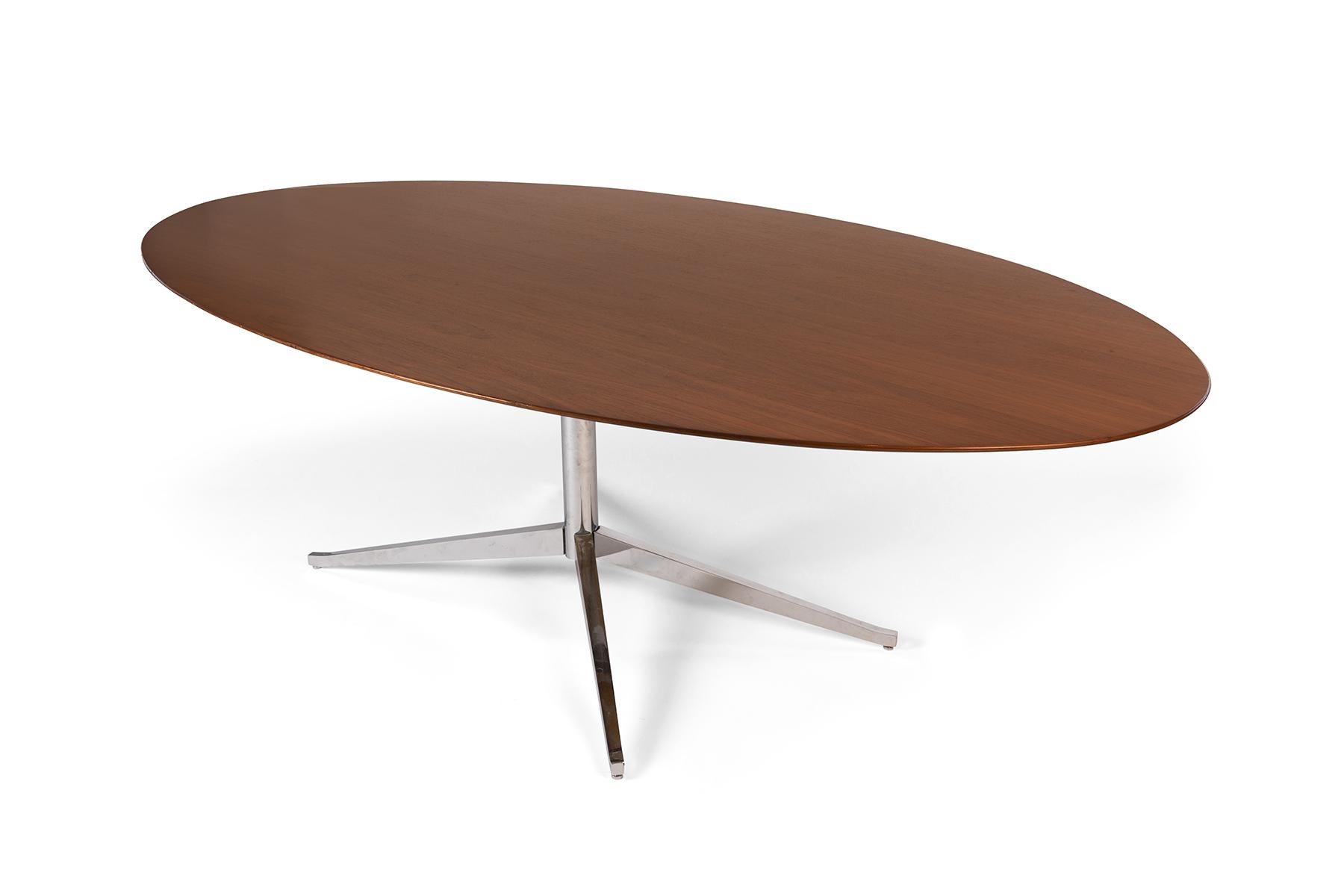 Florence Knoll oval dining table with chrome plated steel base. Table is all original and is the larger harder to find 8' length. Retains Knoll label.