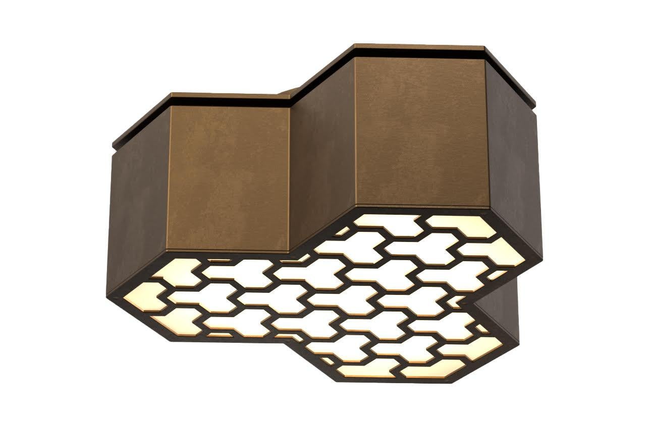 The modular Knossos light is a custom flush mounted light fixture, designed by David Duncan Lighting, with a brass frame in the form of a 12 sided polygon. Each flush mount features a grid pattern that is a tessellation of its own form. This fixture