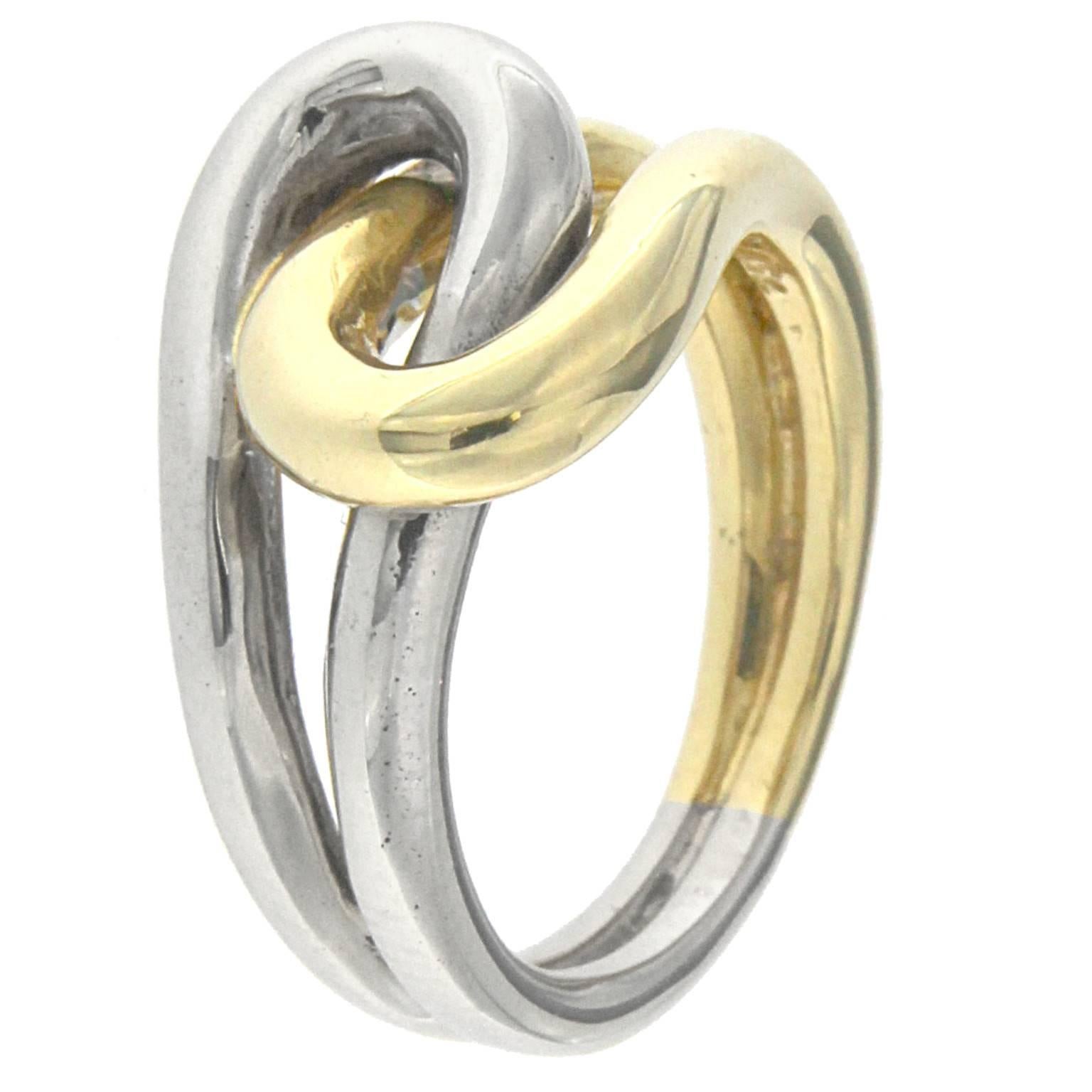 Knot Ring in 18 kt  yellow  and white gold

the total weight of the gold is  gr 10.30


STAMP:  750
US SIZE 5
