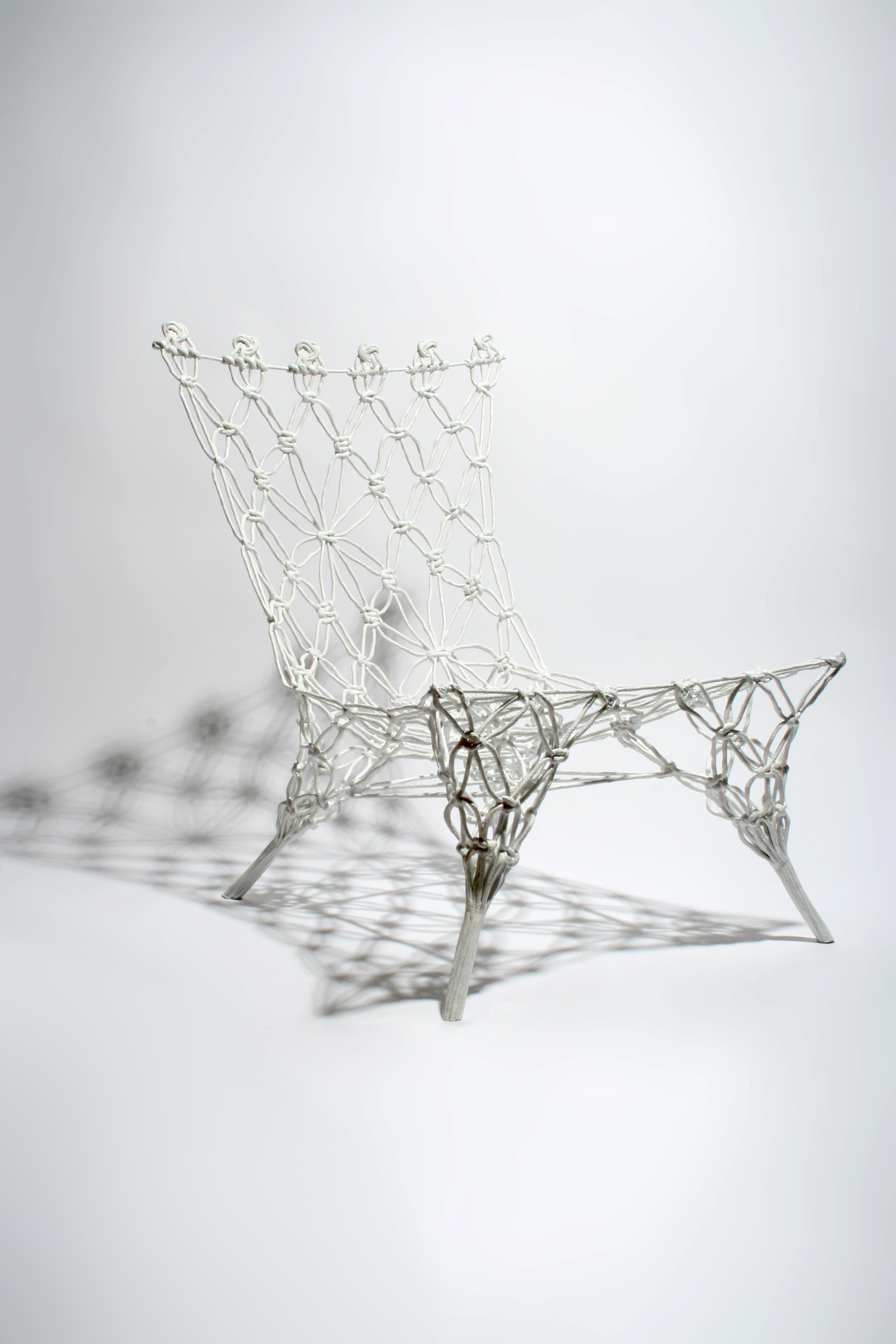 Knotted chair - White is a hand-knotted prototype chair, year of design 2007, unique piece

Eliminating the line between craft and industry, the ‘Knotted Chair’ combines hand-crafted tactile design with high-tech industrial processes to surprise