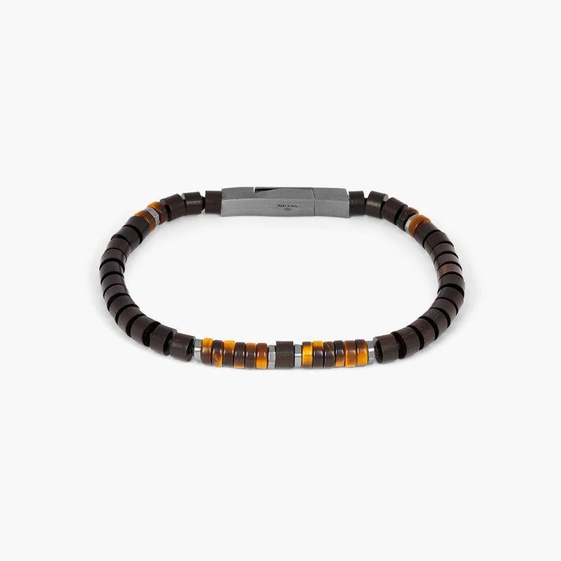 Knotted Fettuccine Bracelet in Ebony Wood & Tiger Eye Beads with Black Rhodium Silver Clasp, Size S

The classic fettuccine bracelets have had a style update with this unusual design. Featuring tiger ebony wood beads combined tiger eye or lapis