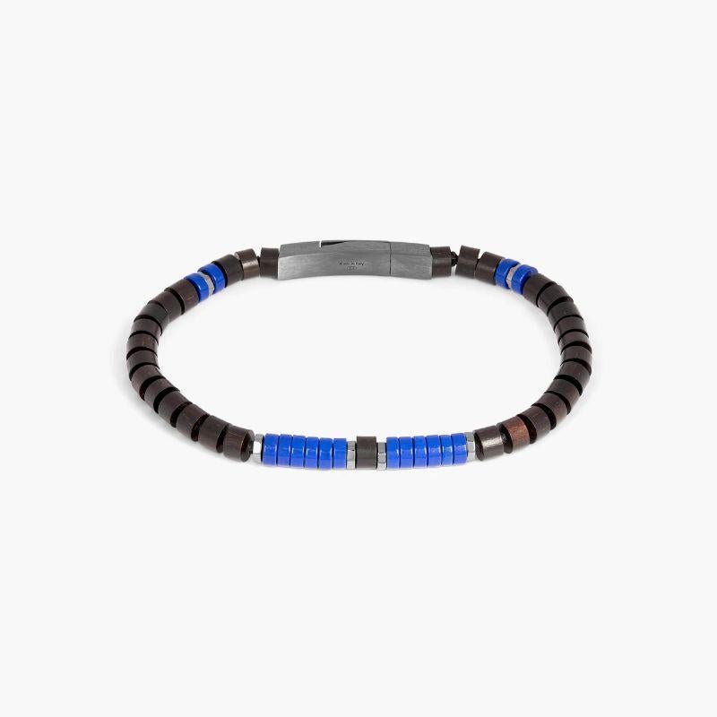 Knotted Fettuccine Bracelet in Wood Bead & Lapis, Size M

The classic fettuccine bracelets have had a style update with this unusual design. Featuring tiger ebony wood beads combined tiger eye or lapis semi-precious stone discs this style has been