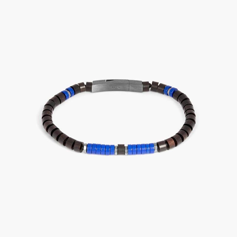 Pulsera anudada de cuentas de madera y lapislázuli, talla M

Las clásicas pulseras fettuccine han tenido una actualización de estilo con este inusual diseño. Con cuentas de madera de ébano de tigre combinadas con discos de ojo de tigre o piedras