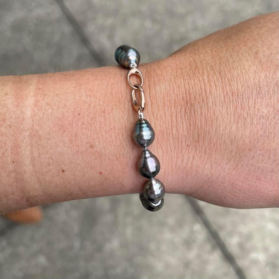 A 7 inch knotted bracelet with 8 x 10mm baroque Tahitian pearls with an 14k rose gold clasp. This bracelet was designed and made by llyn strong.