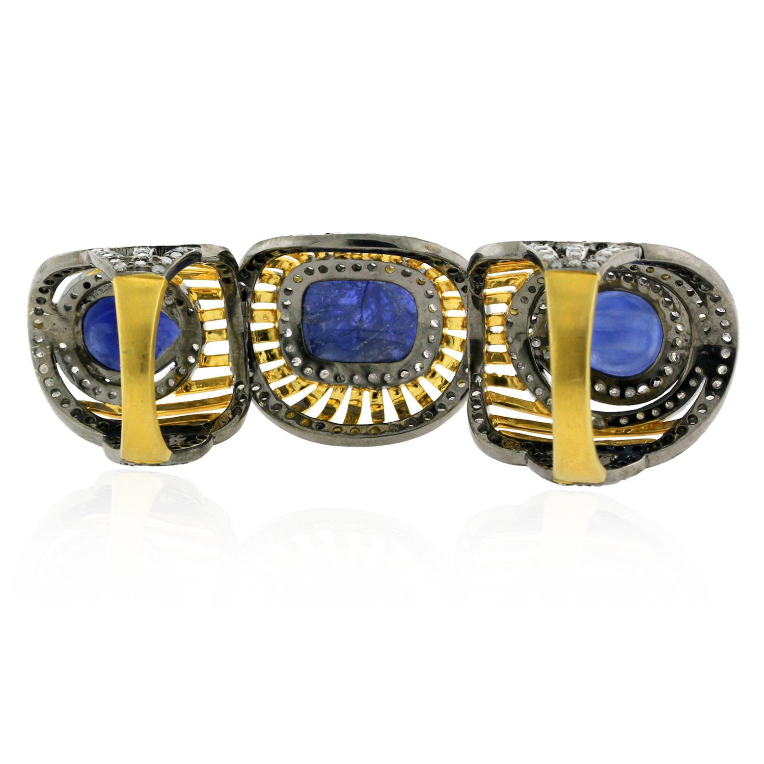 Art Deco Knuckle Ring with Blue Sapphires Carvings Surrounded by Pave Diamonds For Sale