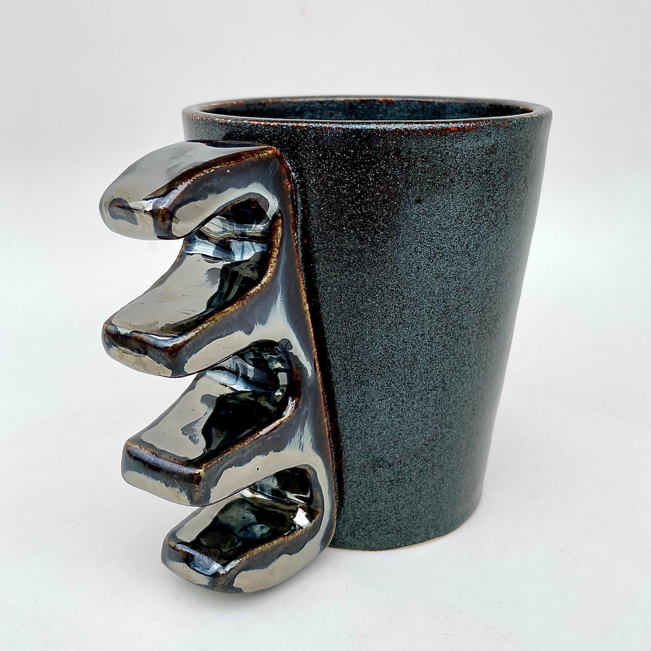 The Knuckler Four Finger V, shown here in moss and broken silver, the food safe vessel for your favorite beverage of choice, entertaining, or as a decorative object/object d'art. Versatile, sustainable and one of kind, made of recycled stoneware and