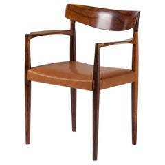 Poltrona Knud Faerch in palissandro con seduta in pelle anni '60