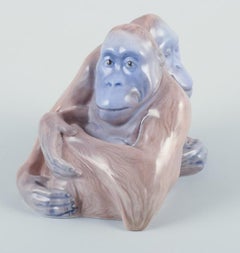 Knud Kyhn for Royal Copenhagen. Rare porcelain figurine of two orangutans.