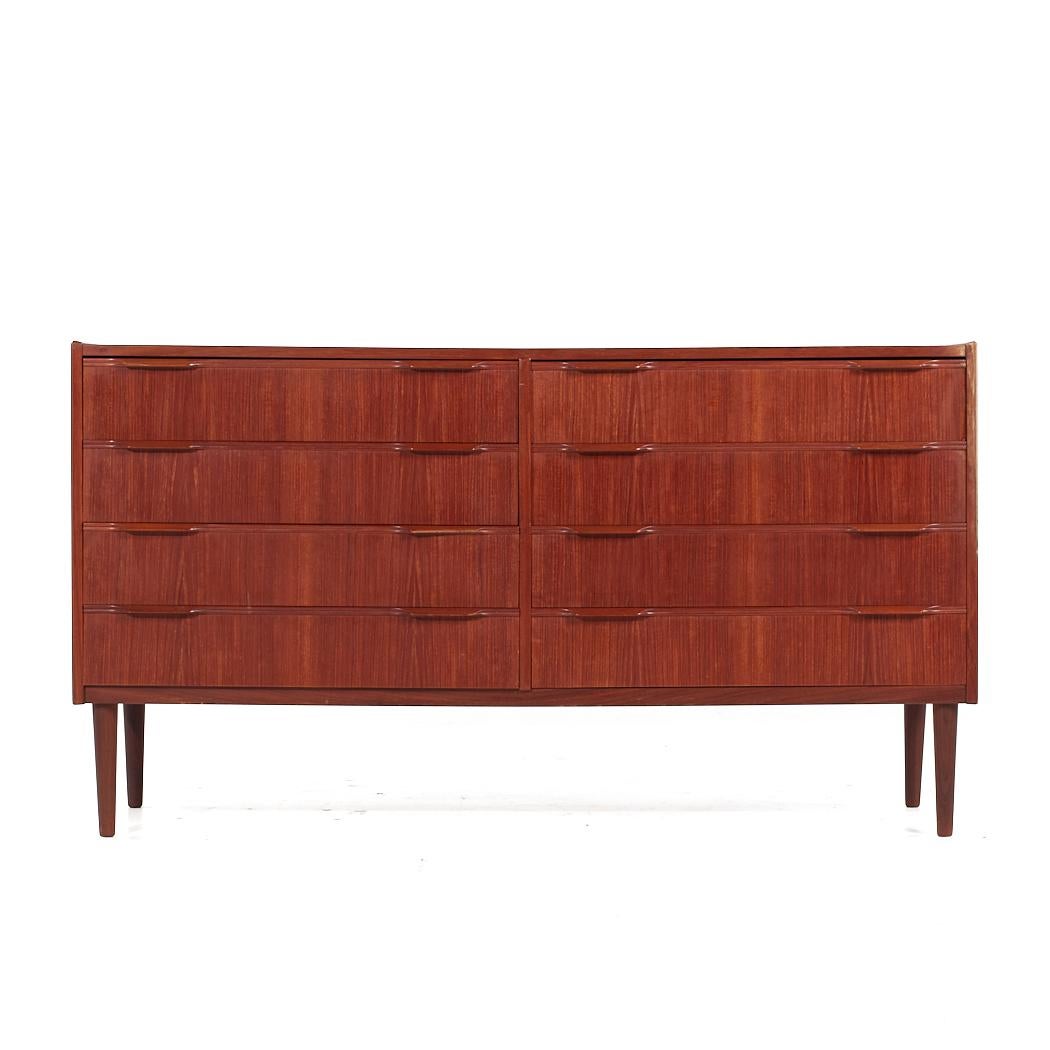 Knud Nielsen Mid Century Danish Teak 8 Drawer Lowboy Dresser

This lowboy measures: 57.5 wide x 16.5 deep x 31.75 inches high

All pieces of furniture can be had in what we call restored vintage condition. That means the piece is restored upon