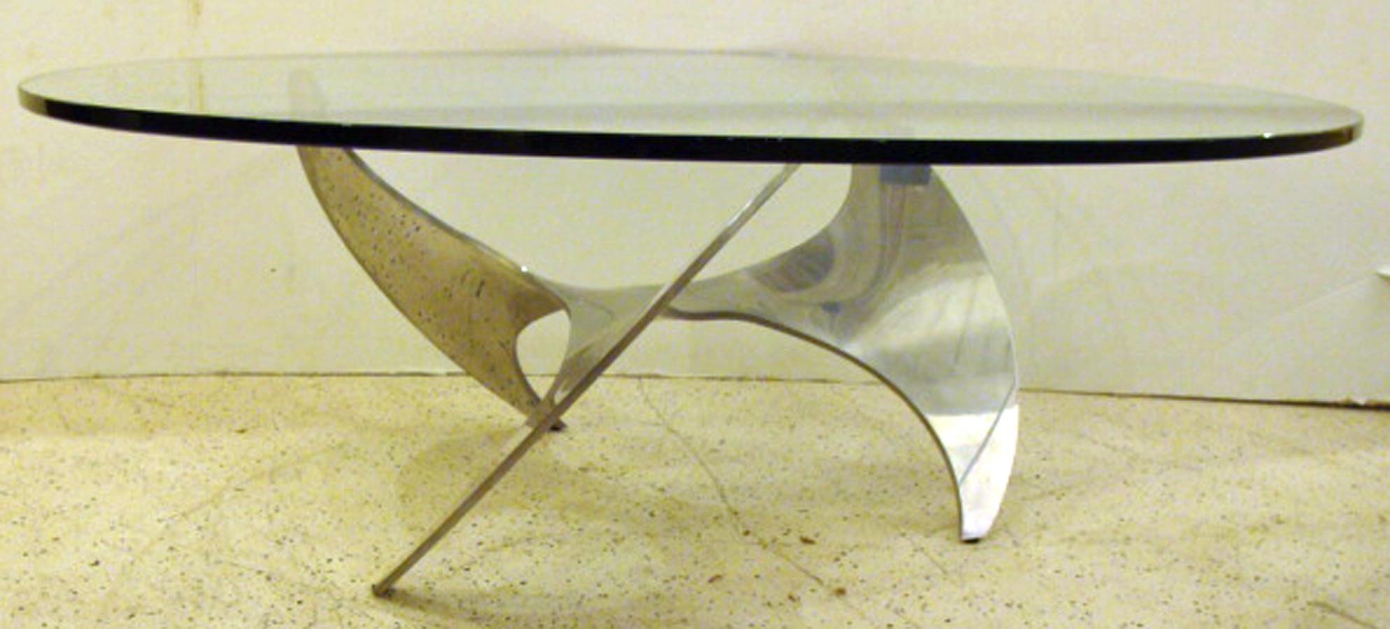 Knut Hesterberg, important German Sculptor. 
Vintage coffee table in beautiful condition. Clear glass top on
aluminum base. Designed for Ronald Schmitt, 1964.

Note: aluminum is a natural 