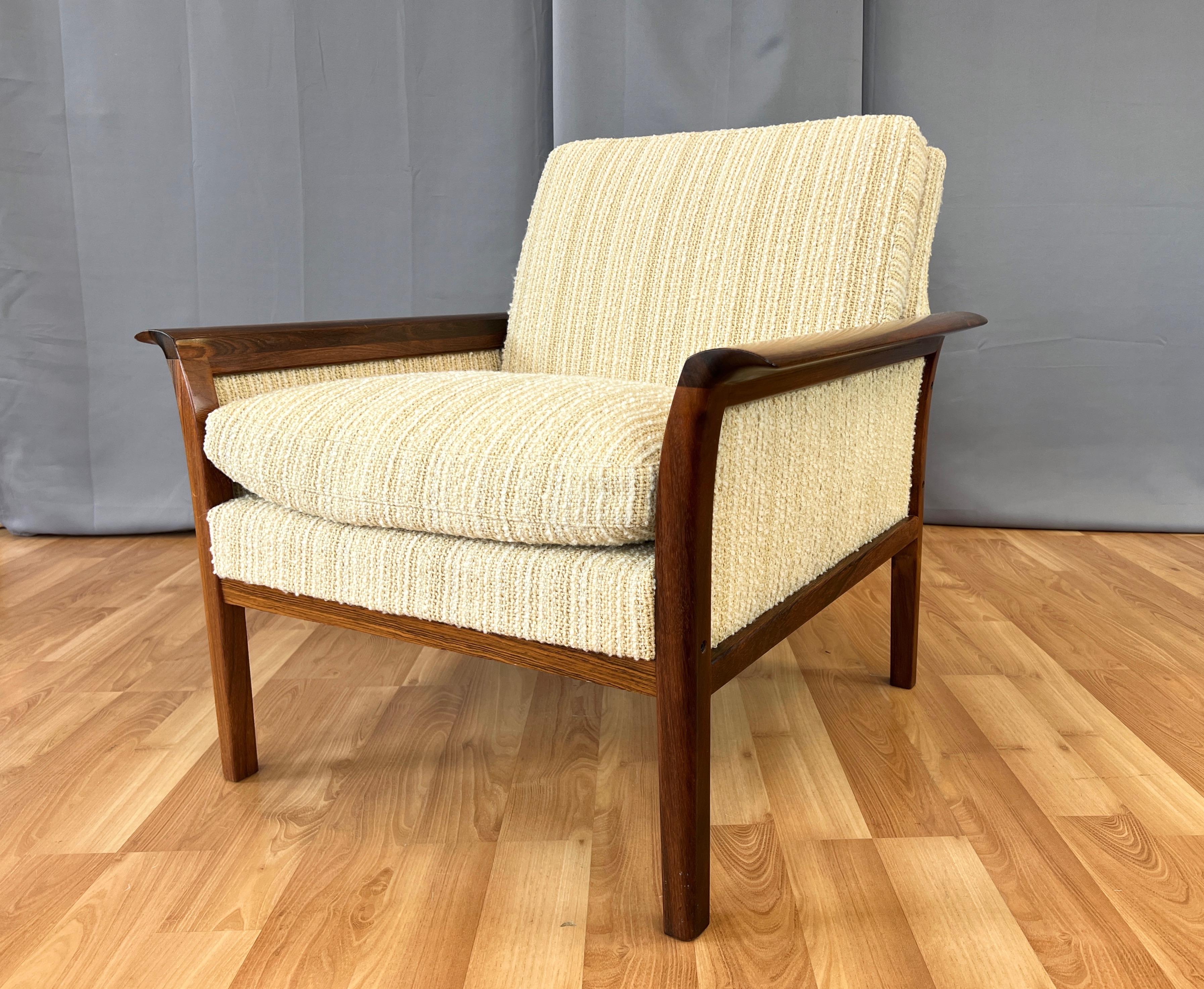 A very handsome 1976 rosewood and upholstery model 934 low-back lounge chair by Knut Sæter for Vatne Møbler of Norway, and originally retailed by Copenhagen in San Francisco.

Features a solid rosewood frame with distinctive and sculptural waterfall