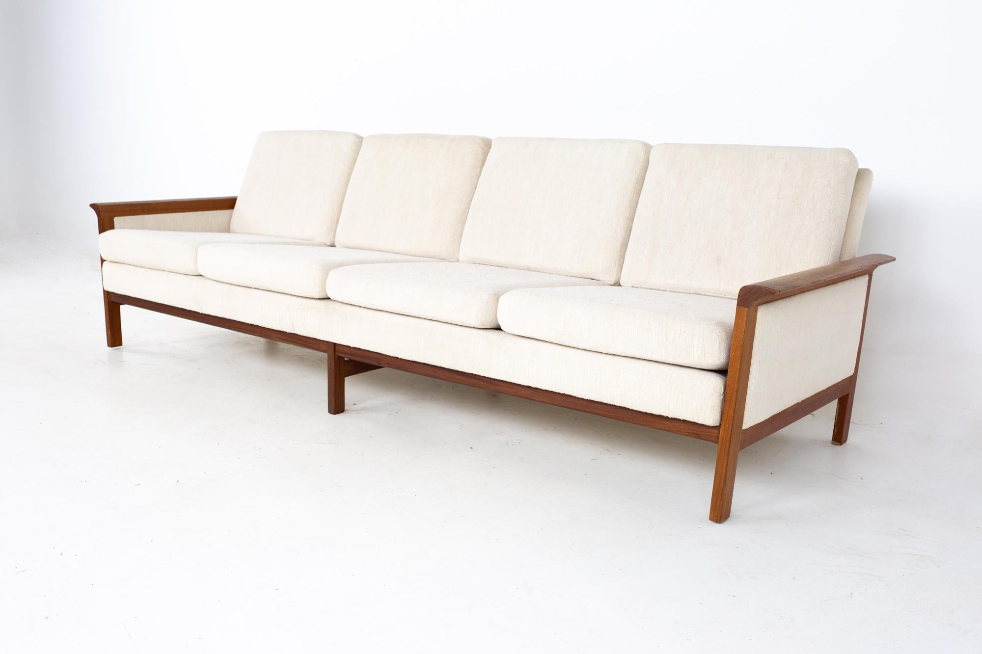 Knut Saeter for Vatne Mobler style mid century Danish teak four seater sofa.
Sofa measures: 96 wide x 32 deep x 30 high, with a seat height of 17 inches and an arm height of 20 inches

 All pieces of furniture can be had in what we call restored