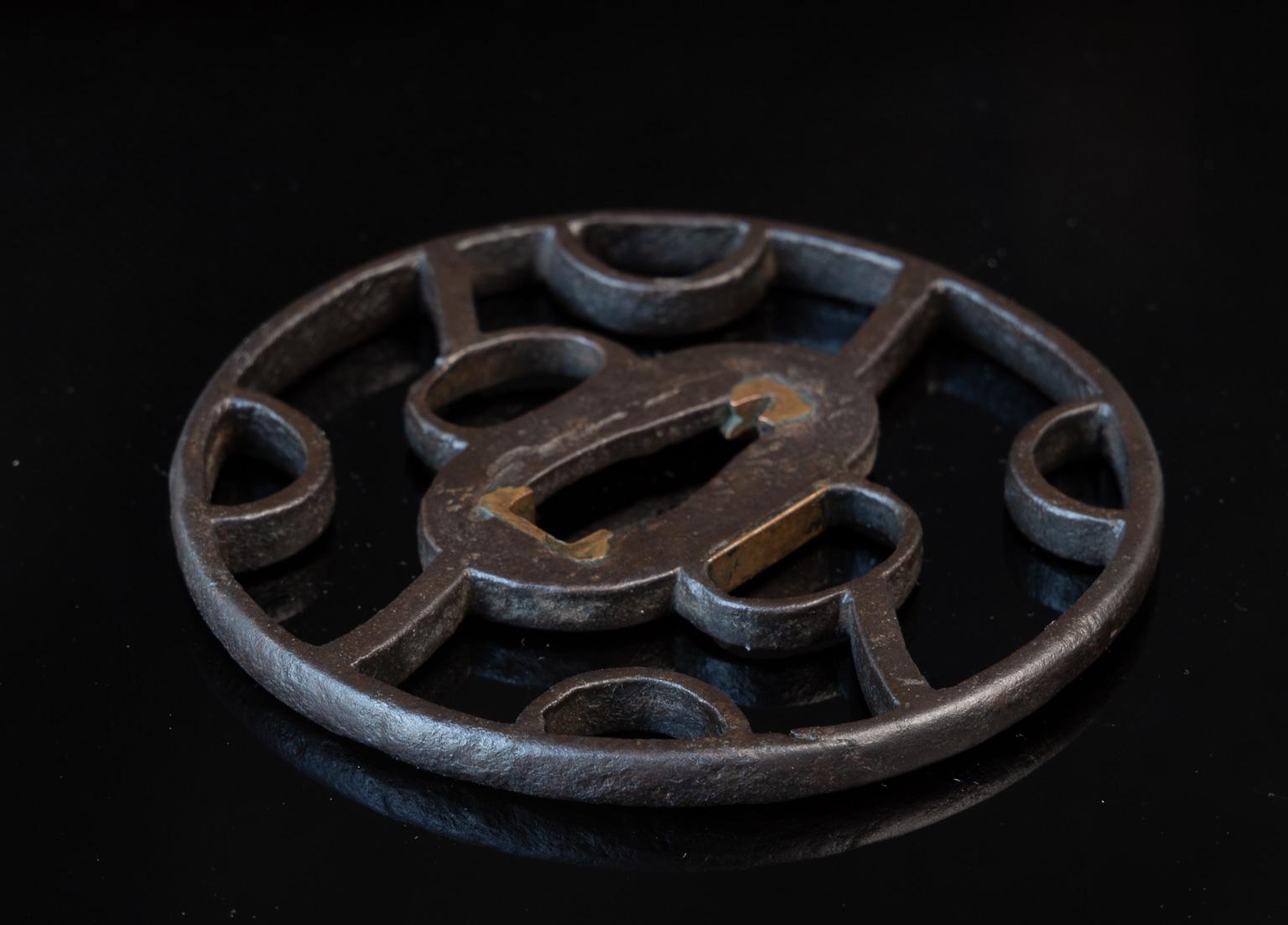 Marugata, diameter: 8 cm; thickness 5 mm 

Certification: the tsuba comes with a Tokubetsu Hozon Tosogu certificate issued by the NBTHK. 

 

The tsuba shows a unique yet simple and strong design. The patina is excellent and tekkotsu is