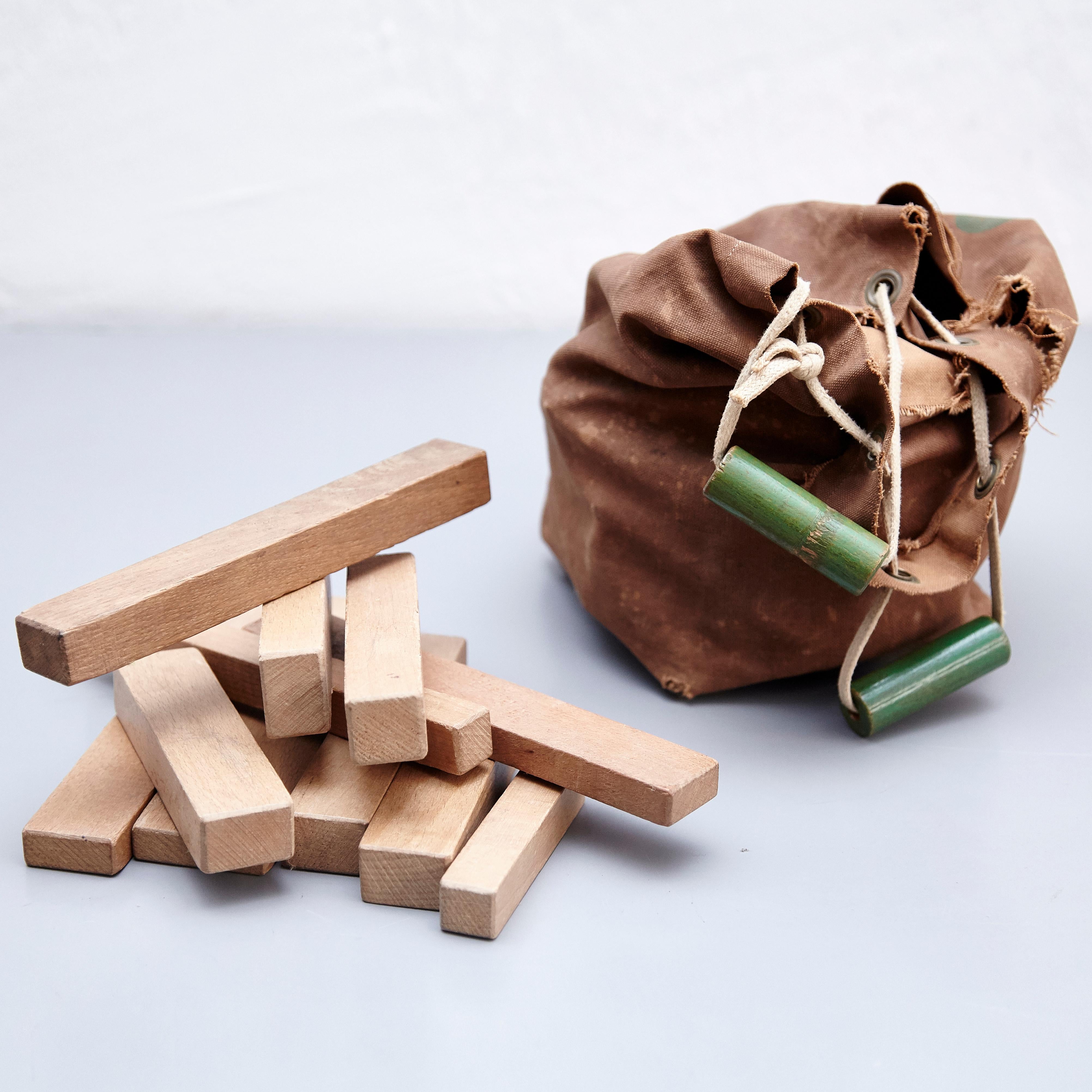 Toy designed by Ko Verzuu, circa 1950.
Manufactured by ADO in Netherlands.

ADO Blokken, canvas bag with a set of wooden blocks / cubes to play.

In good original condition, with minor wear consistent with age and use, preserving a beautiful