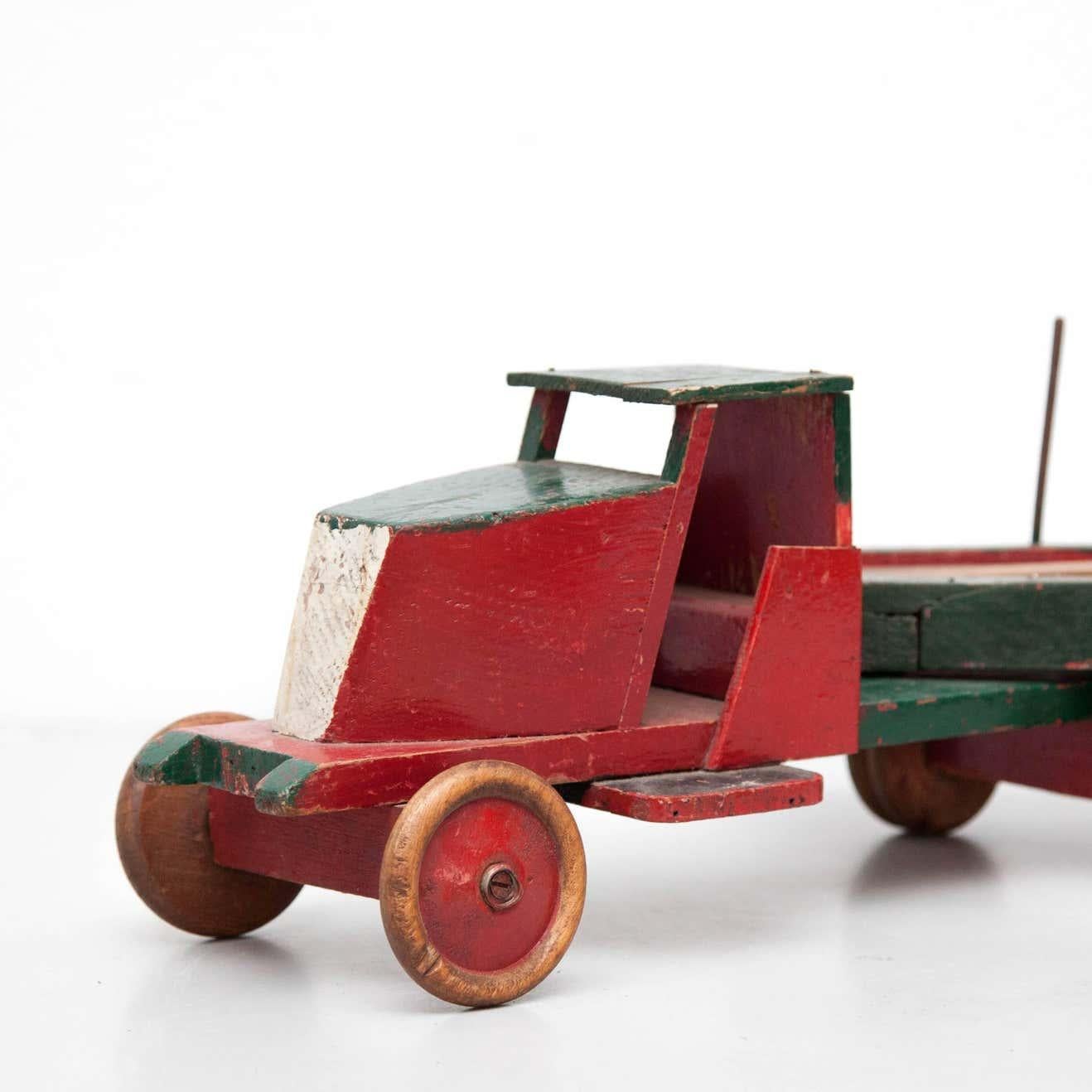 Toy designed by Ko Verzuu, circa 1940.
Manufactured by ADO in Netherlands.

Truck & trailer of wood 