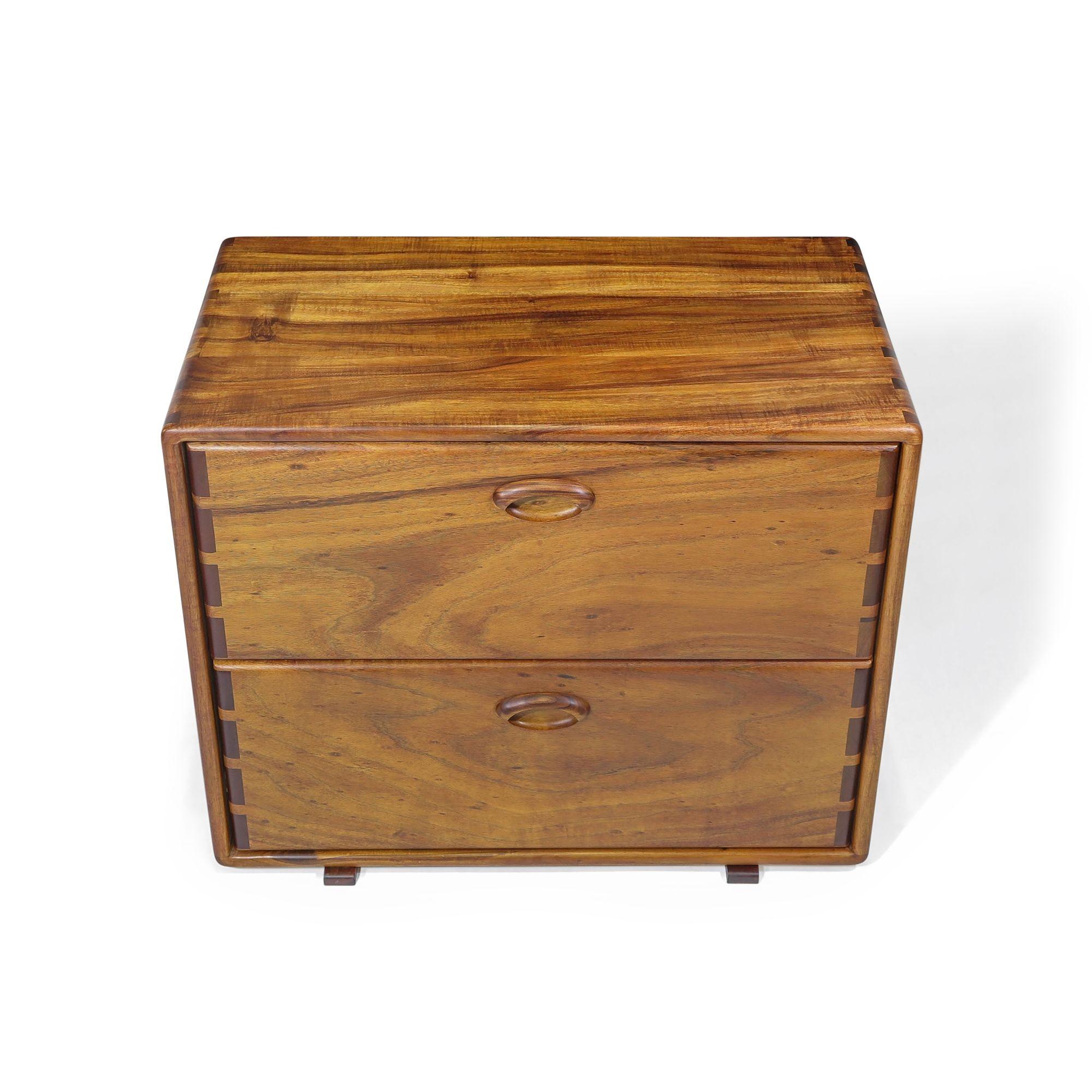 California studio Craft filing cabinet designed by Jim Sweeney, Berkeley, circa 1983. The cabinet is handcrafted of solid Koa wood, and features two filing drawers with boldly exposed joinery on the cabinet and drawers. The cabinets have been