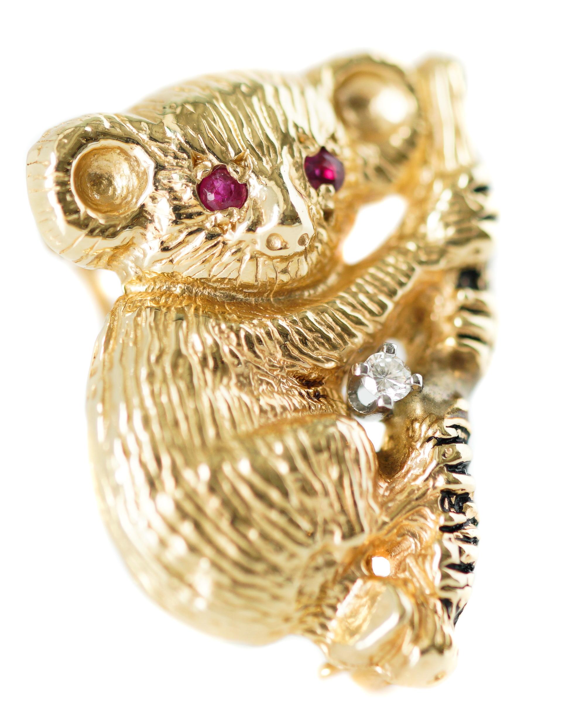 Gold Koala Pin - 14 karat Yellow Gold, Rubies, Diamond

Features:
Adorable Koala Bear hugging a Eucalyptus Tree Branch
Finely Detailed Furry Texture on Round Head and Body
Fine Feature details include Big Furry Ears, Soft Nose, Tiny Mouth, Tiny Paws