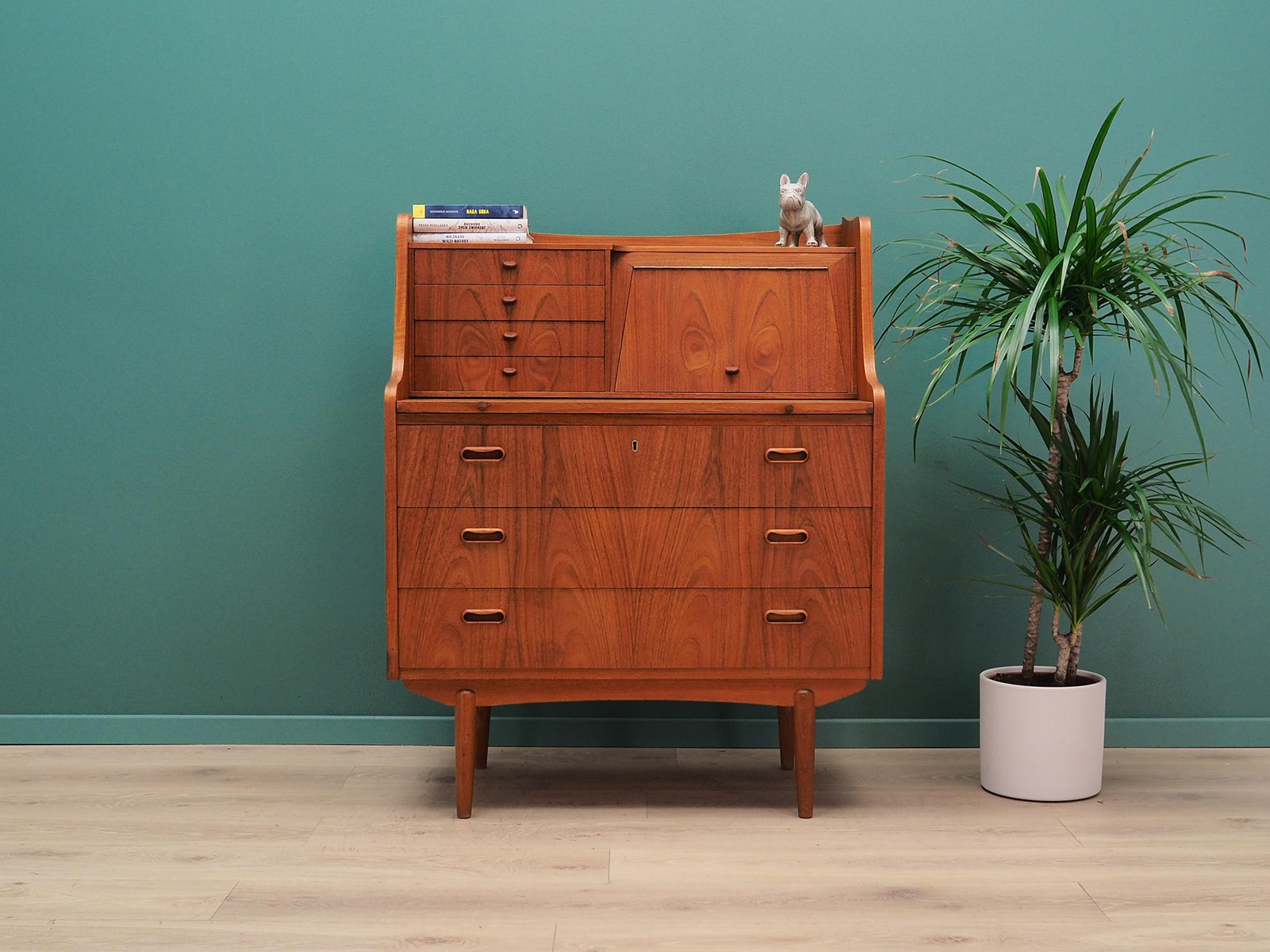 Classic secretary from the 1960s-1970s. Scandinavian design, Minimalist form. Furniture made in AG Spejl Kobberbeskyttet manufactory, all covered with teak veneer, legs made of solid teak wood. Secretary has a pull-out bar, also four stylish drawers