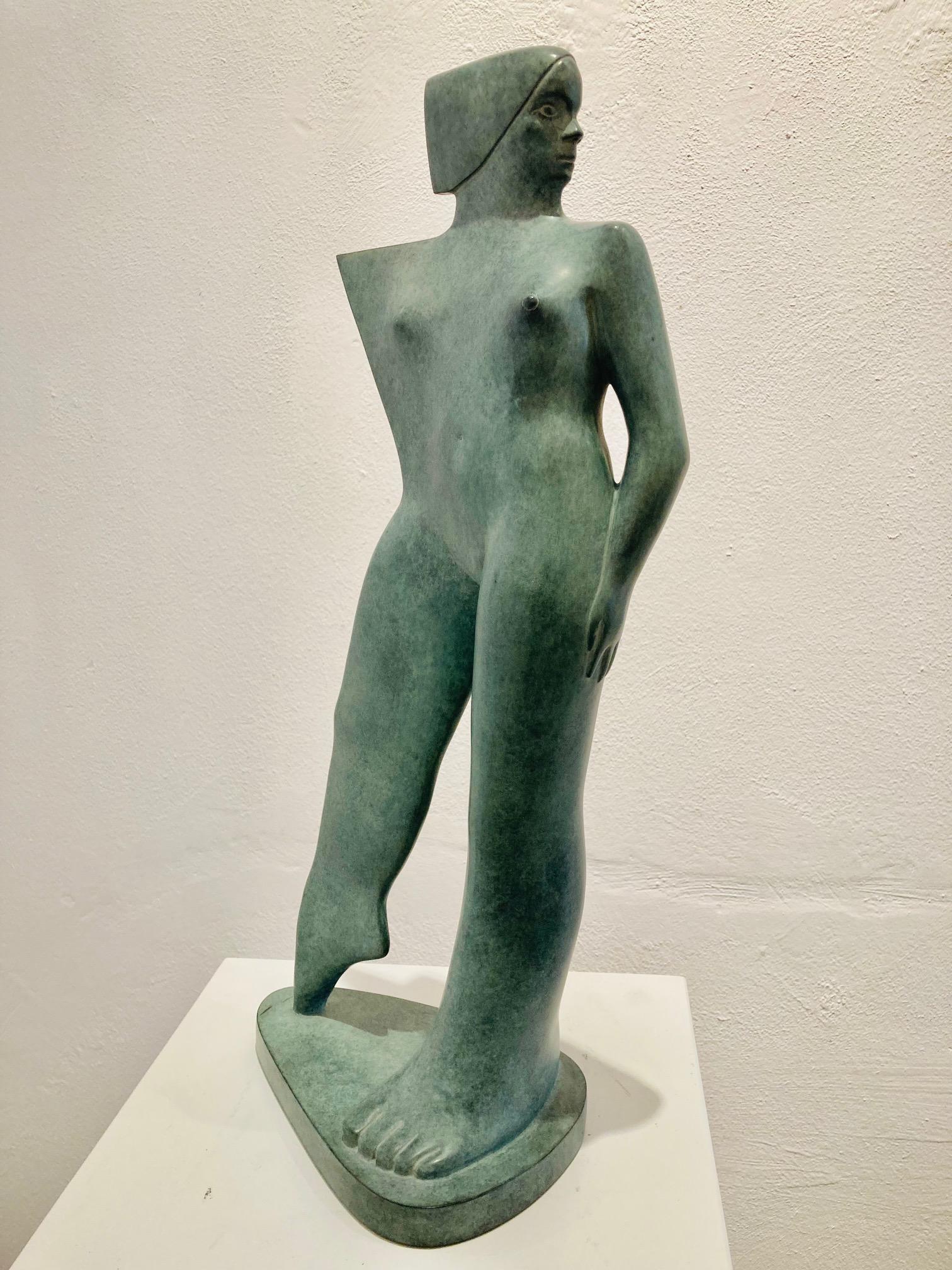 Donnina in Piedi Bronze Sculpture Standing Woman 
KOBE, pseudonym of Jacques Saelens, was a Belgian artist (Kortrijk, Belgium 1950 – Saint-Julien (Var), France 2014).

He combined the broad with sophistication. Two themes dominated his artworks: the