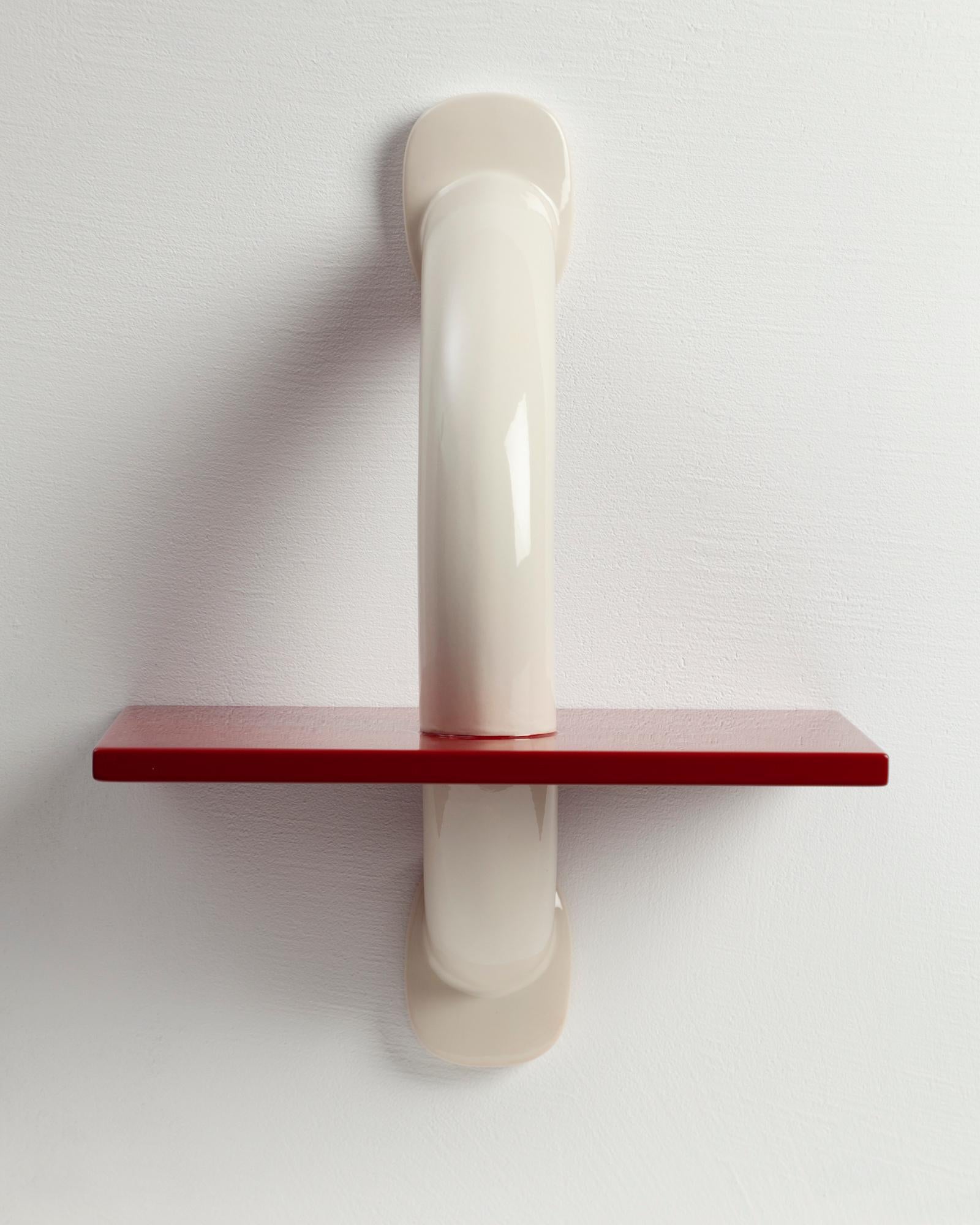 Kobe Wall Light by Kira Design
Dimensions: W 25 x D 16 x H 33 cm
Materials: Ceramic, Lacquered Wood
Available Colors: Mustard Yellow, Red, Green

The Kobe wall light has been designed with a particular desire to create emotion and rhythm in your