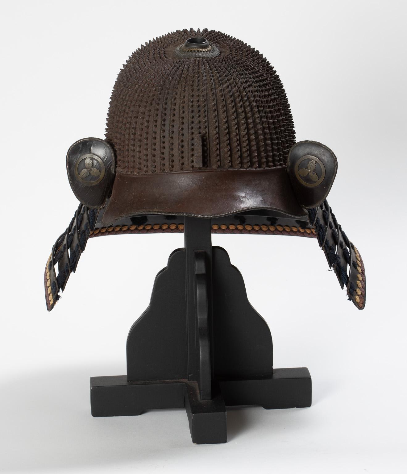 Early Edo period (1615-1867)

Haruta School, 17th century

A 58-plate koboshi-bachi [helmet bowl with small standing rivets] of typical tenkokuzan form, with 30 pointed rivets on each plate decreasing in size towards the top, with the exception