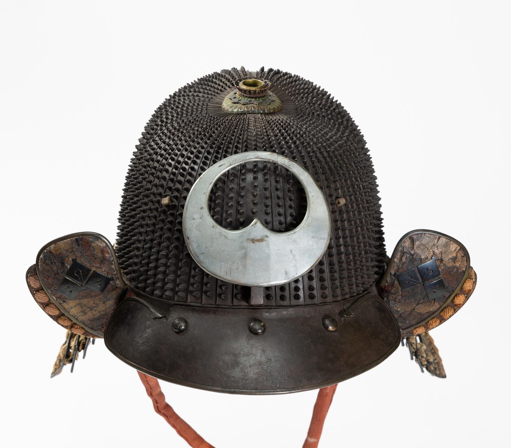 Koboshi kabuto
Samurai helmet with standing rivets
Haruta School
Early Edo Period, 17th century

A 62-plate koboshi-bachi [helmet bowl with small standing rivets] of typical tenkokuzan form, with 30 pointed rivets on each plate decreasing in