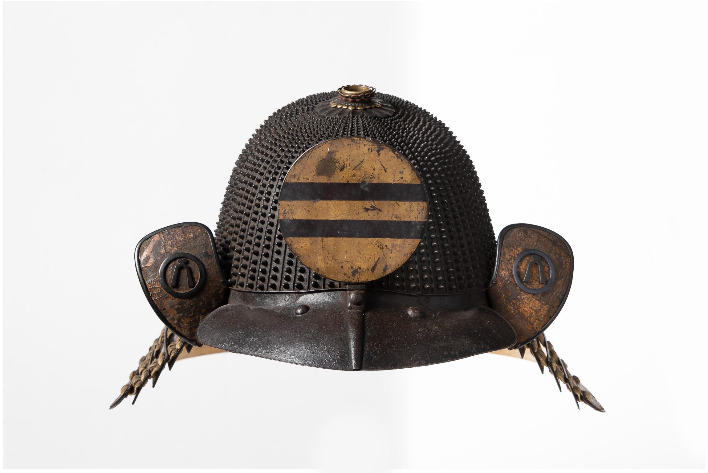 Koboshi kabuto signed Myochin Yoshiie
Samurai helmet with small standing rivets

Edo Period, 17th-18th century

A 62-plate koboshi-bachi of typical tenkokuzan form, with 30 pointed rivets on each plate decreasing in size towards the top, with