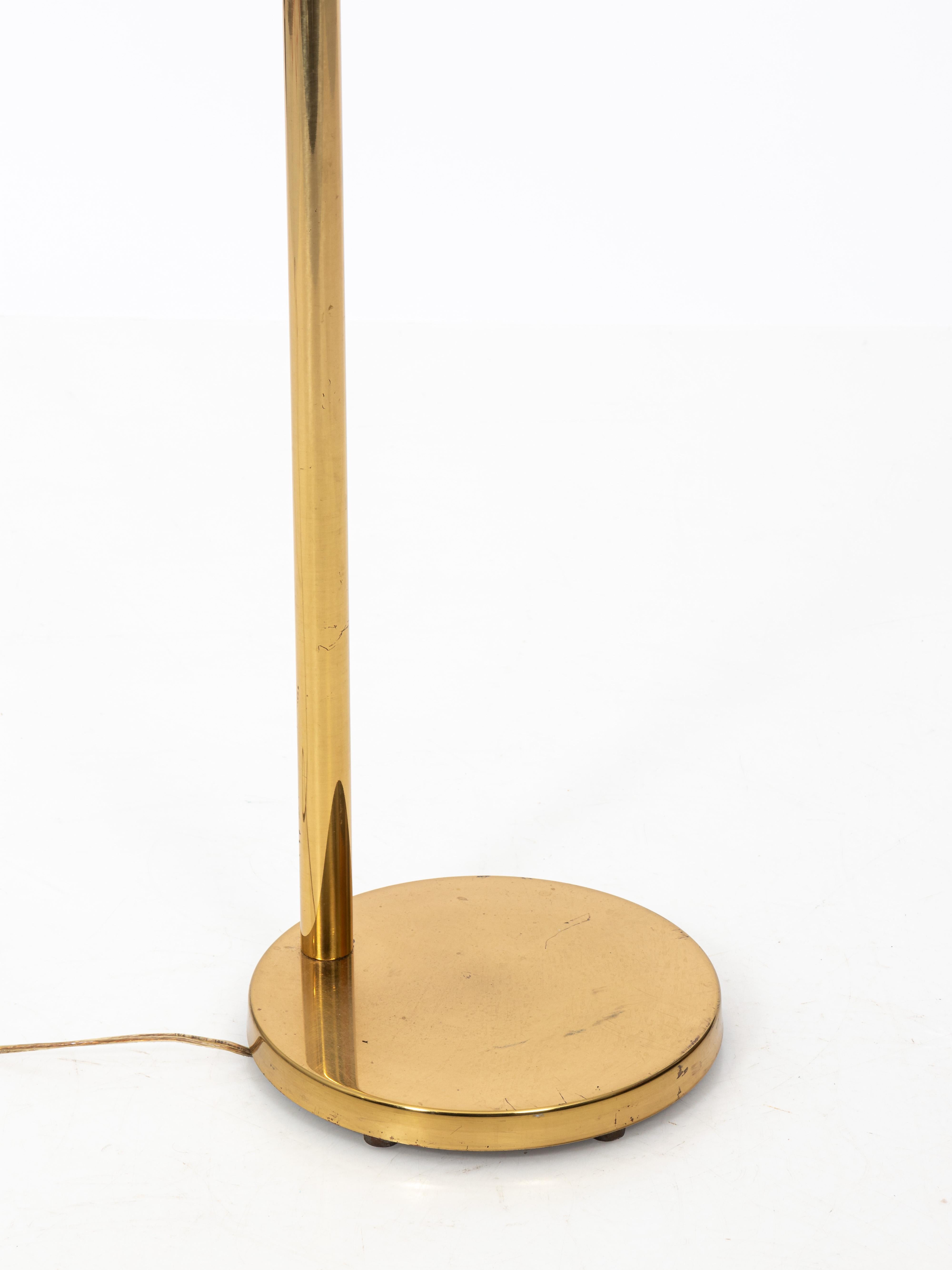 Brass floor lamp by Koch & Lowy with original patina and maker's mark, circa 1960s. The lamp features adjustable height a nd DIM-able light. Made in the United States. Can be boxed and shipped through UPS. Price depends on location.