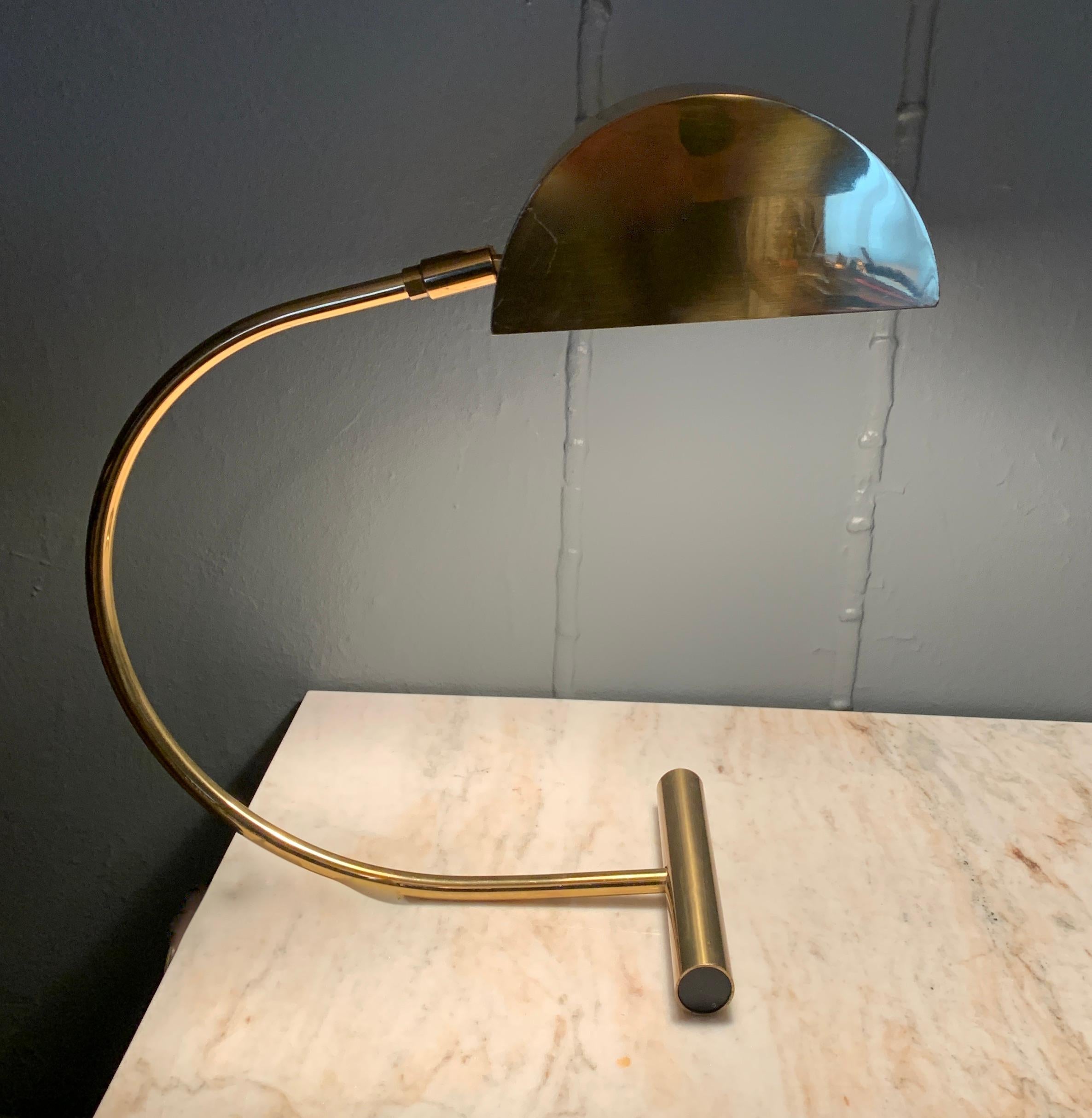 The simplicity and architectural lines of the midcentury Koch and Lowy desk lamp make for a very sexy environment. While the design is quite chic, the head tilts in several directions providing a practical light for reading or an ambient light wall