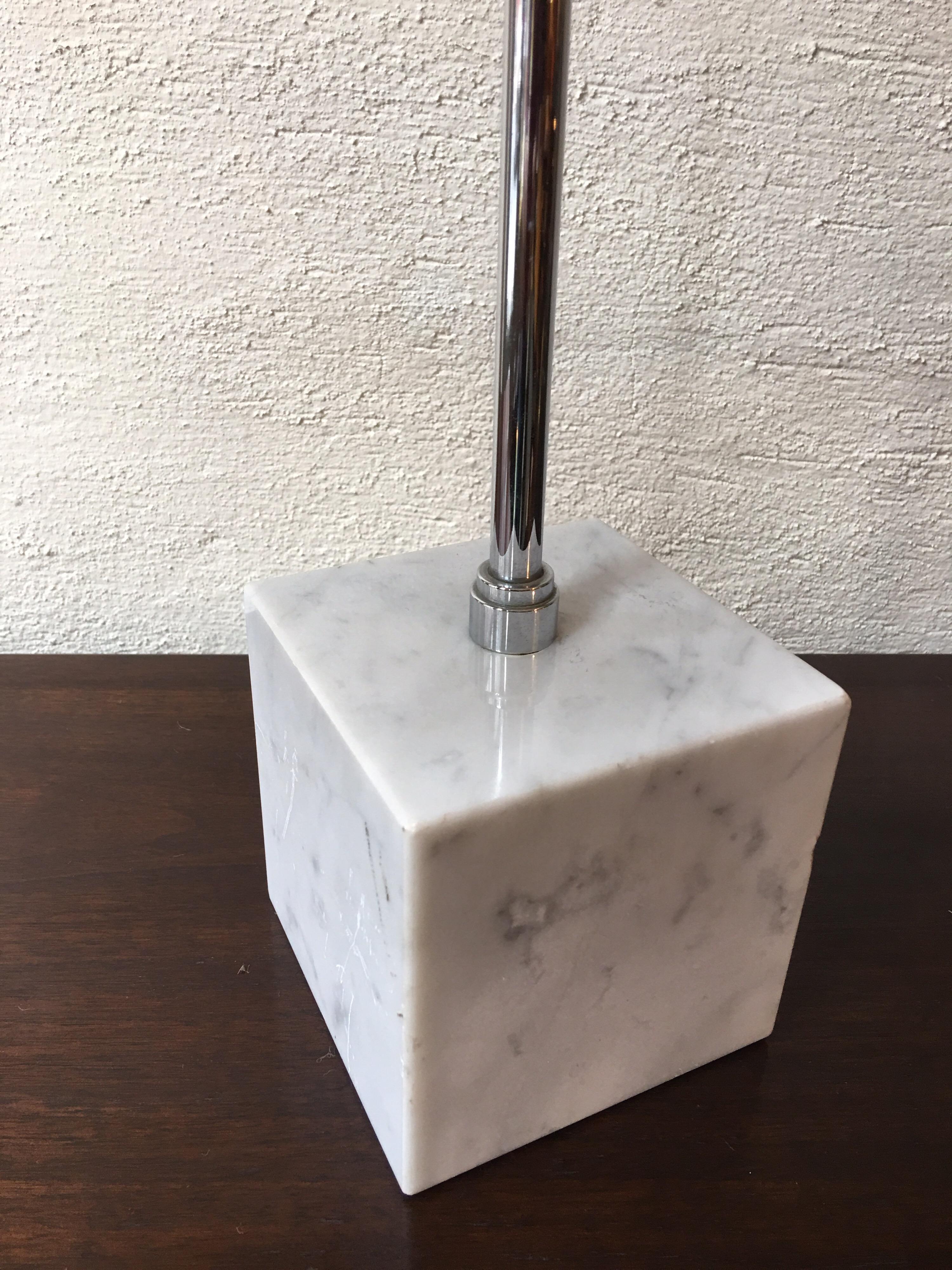 Koch & Lowy marble based table lamp. Chrome shade adjusts and moves in multiple ways. Switch dims.