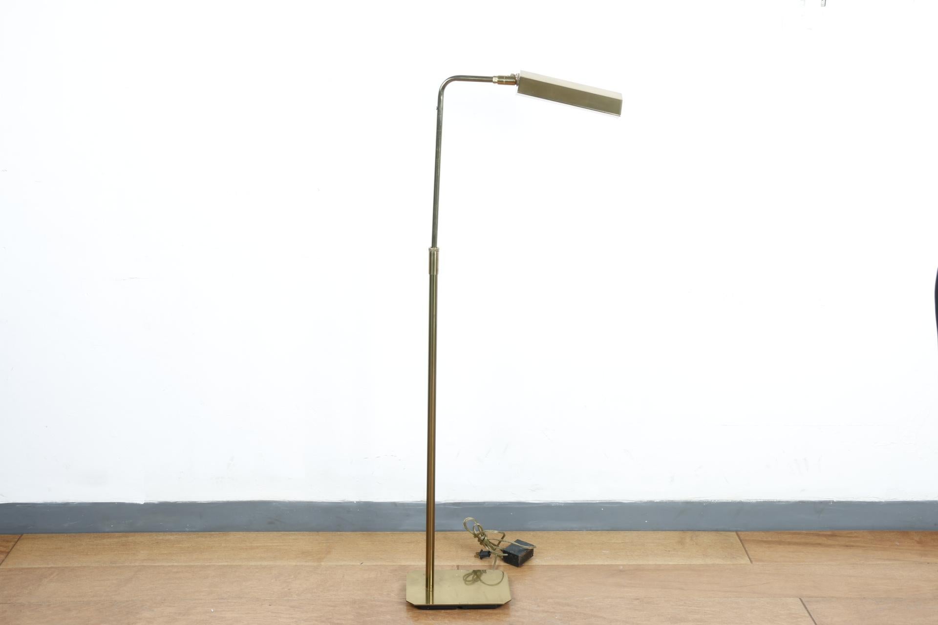 Iconic American made Koch and Lowy Polished brass floor lamp. Beautiful minimal mid century design. Works perfectly and height is adjustable. No scratches or damages.