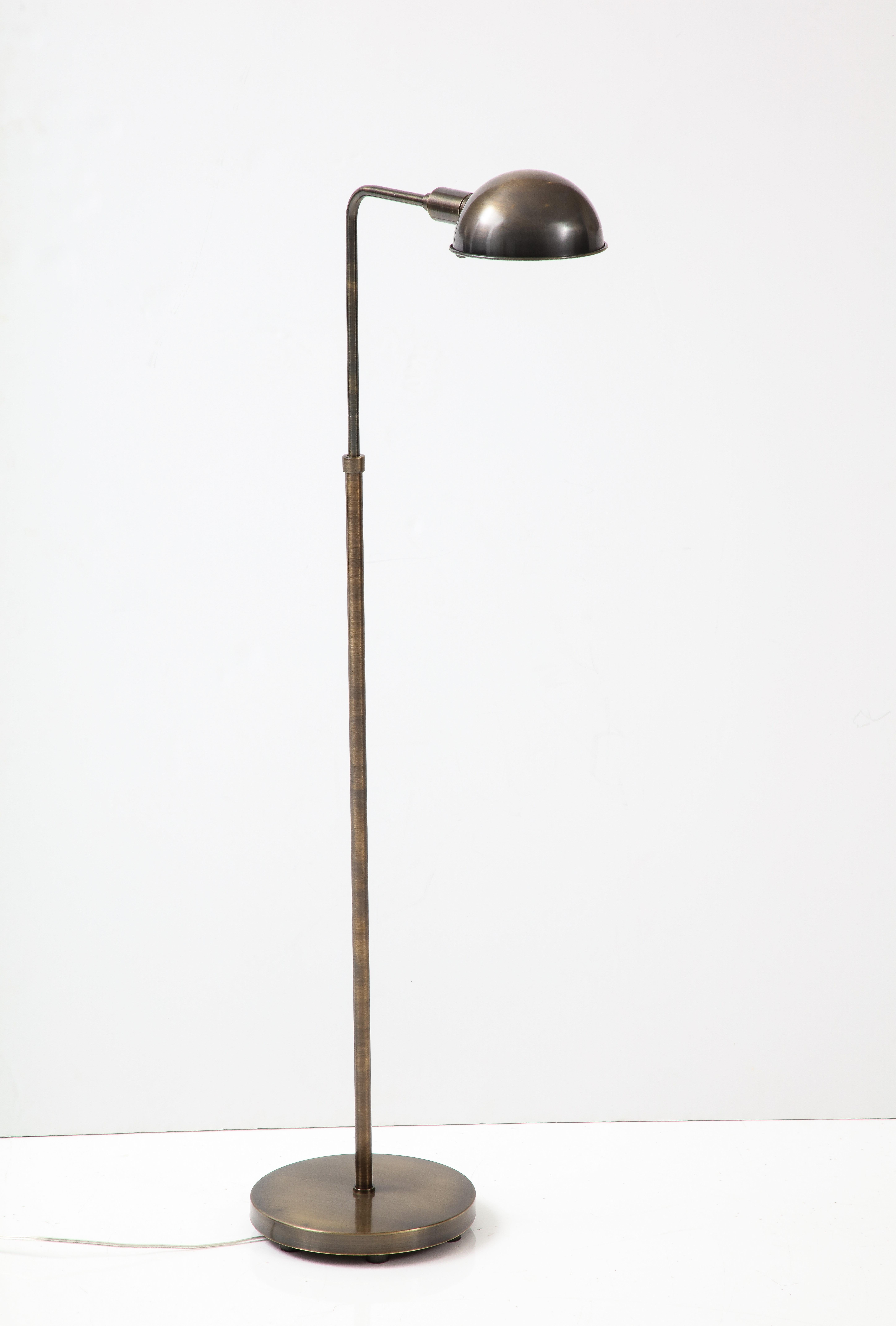 Mid-Century Modern adjustable apothecary floor lamp in a bronzed brass finish. Rewired for use in the USA. 75W max, edison bulb.