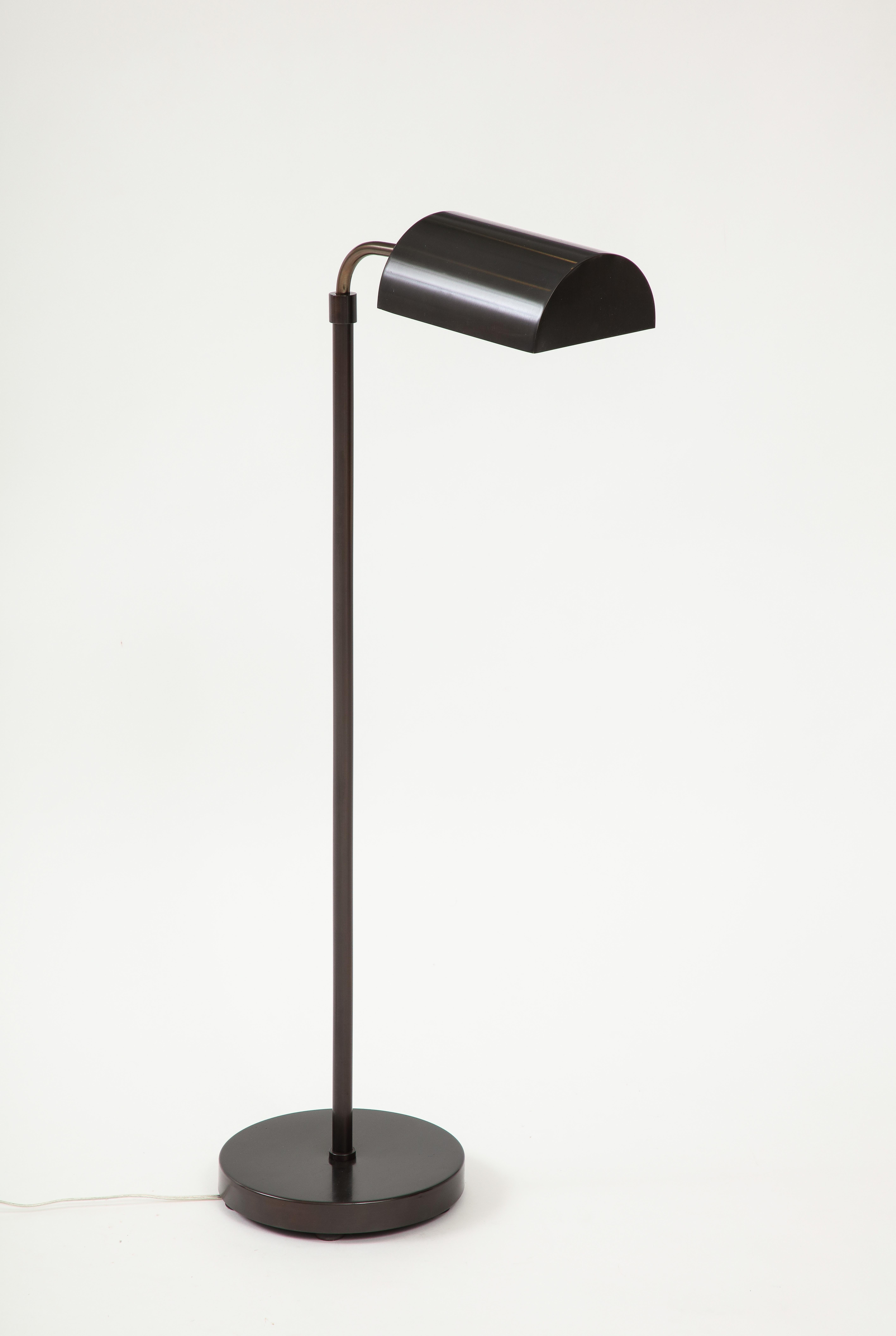 Modernist adjustable height and swiveling head bronze floorlamp by Koch & Lowy, c 70s. Rewired for use in the USA.