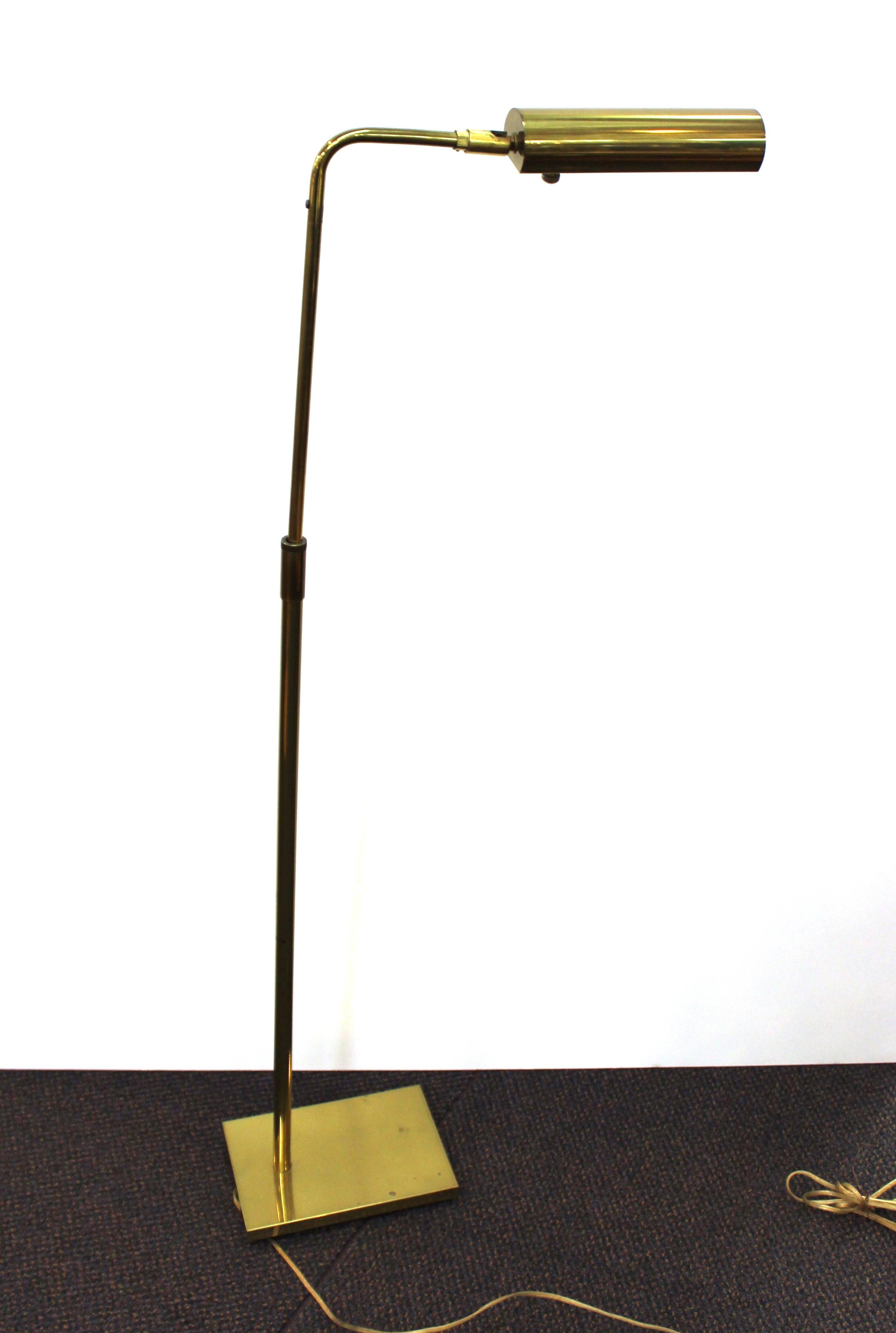 Mid-Century Modern adjustable pharmacy floor lamp in brass, made by Koch & Lowy in the United States during the 1960s. The piece is in great vintage condition with some minor age-appropriate wear. Stamped on the upper neck 'Koch & Lowy'.
