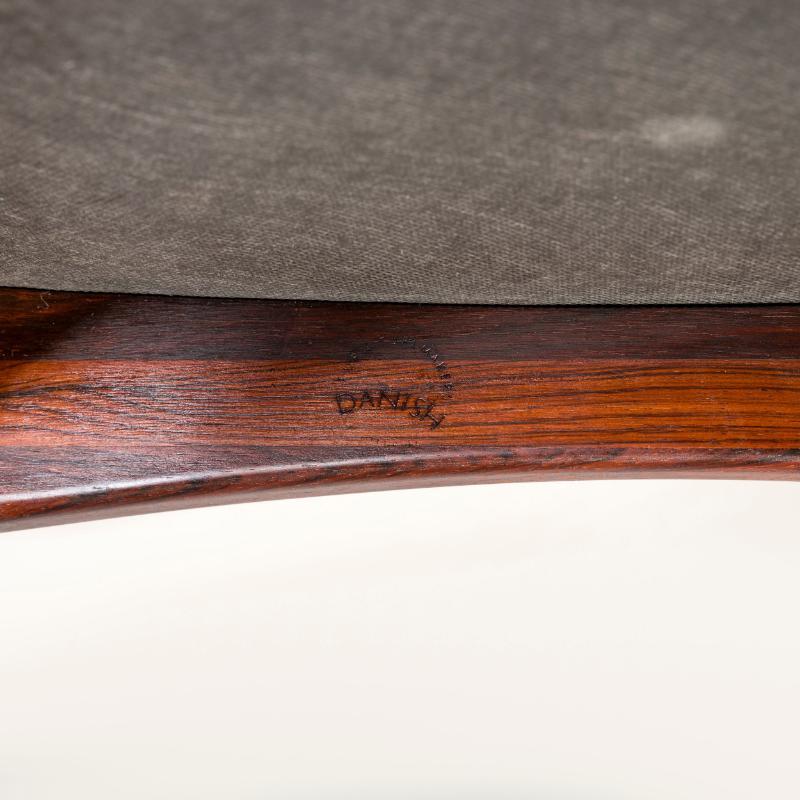 Set of 6 mid-century Danish dining chairs, including 2 carver chairs by Niels Koefoed.    The four regular dining chairs, with tapering high backs, are visually set against the carving chairs with their curved armrests. The leatherette seat pads